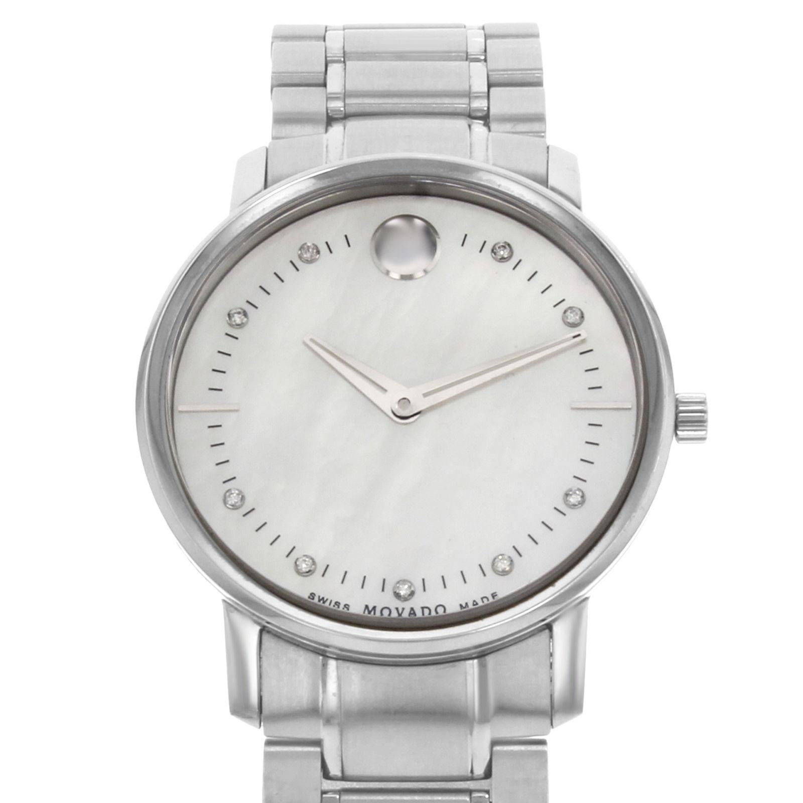 (16146)
This pre-owned Movado TC 0606691 is a beautiful Ladies timepiece that is powered by a quartz movement which is cased in a stainless steel case. It has a round shape face, no features dial and has hand diamonds, sticks style markers. It is