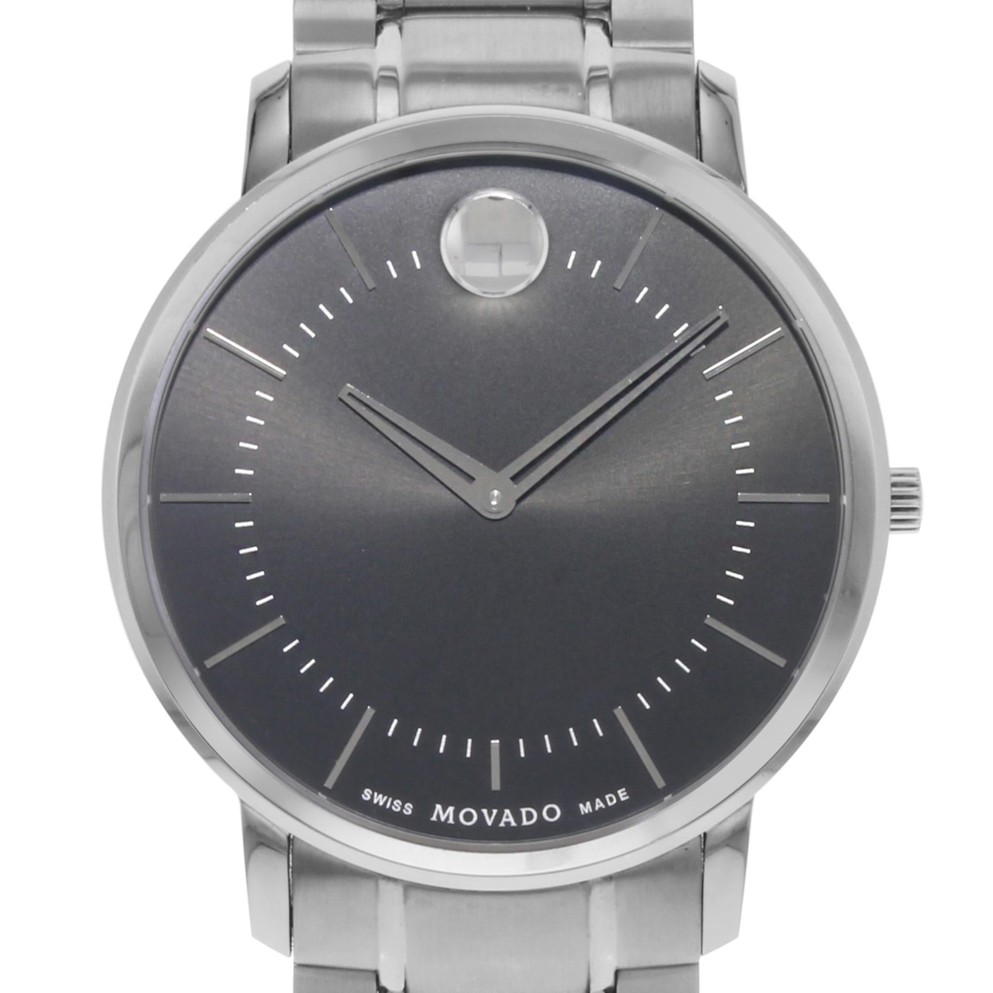 This display model Movado Thin Classic 0606687 is a beautiful men's timepiece that is powered by a quartz movement which is cased in a stainless steel case. It has a round shape face, no features dial and has hand sticks style markers. It is