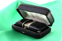 Movado travel watch in silver, mechanical movement with original case