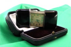 Movado travel watch in silver, mechanical movement with original case