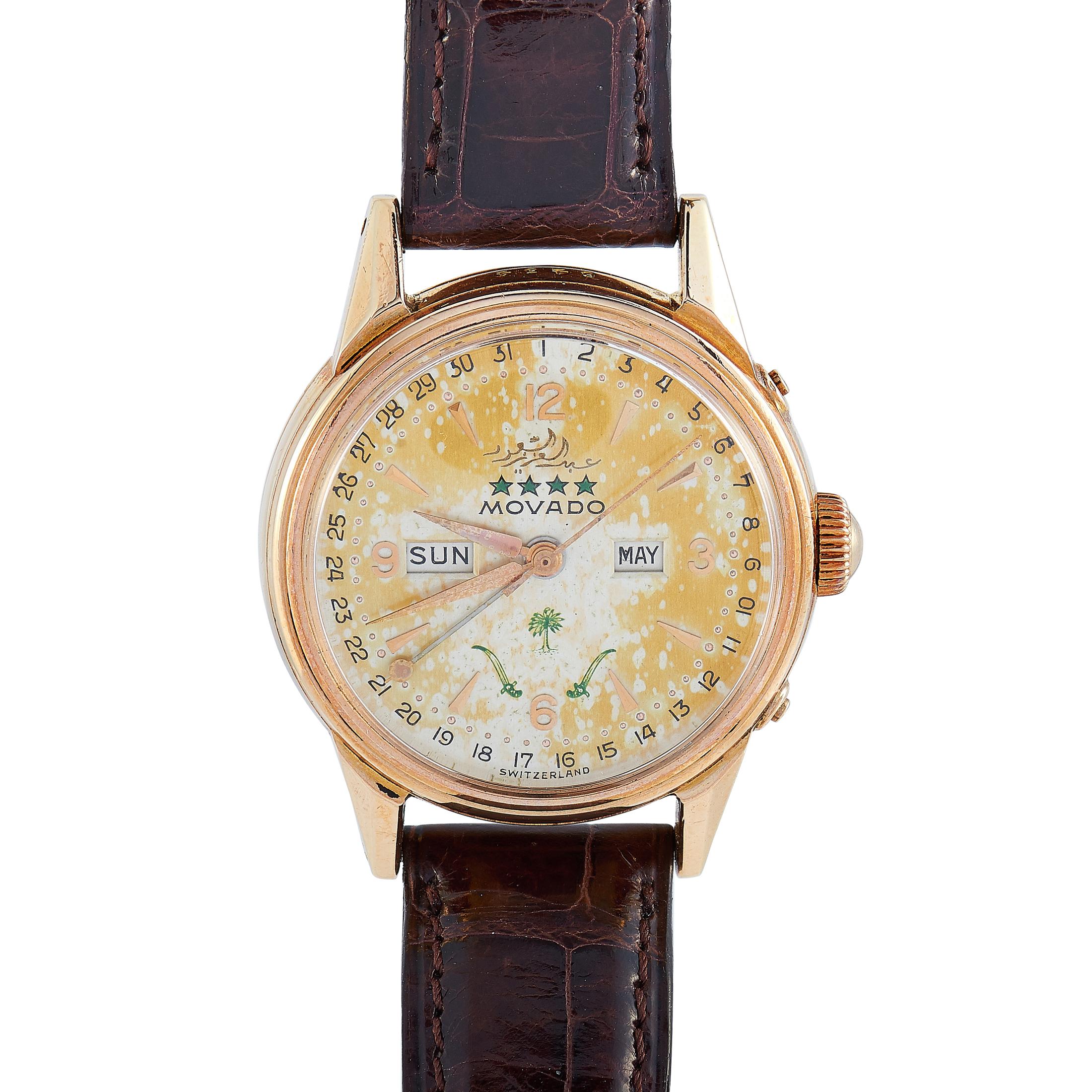 This vintage Movado Datomax timepiece from the 1950s boasts an 18K rose gold case that measures 32 mm in diameter. The case is presented on a brown leather strap fitted with a tang buckle. 
The original untouched silver dial is embellished in green