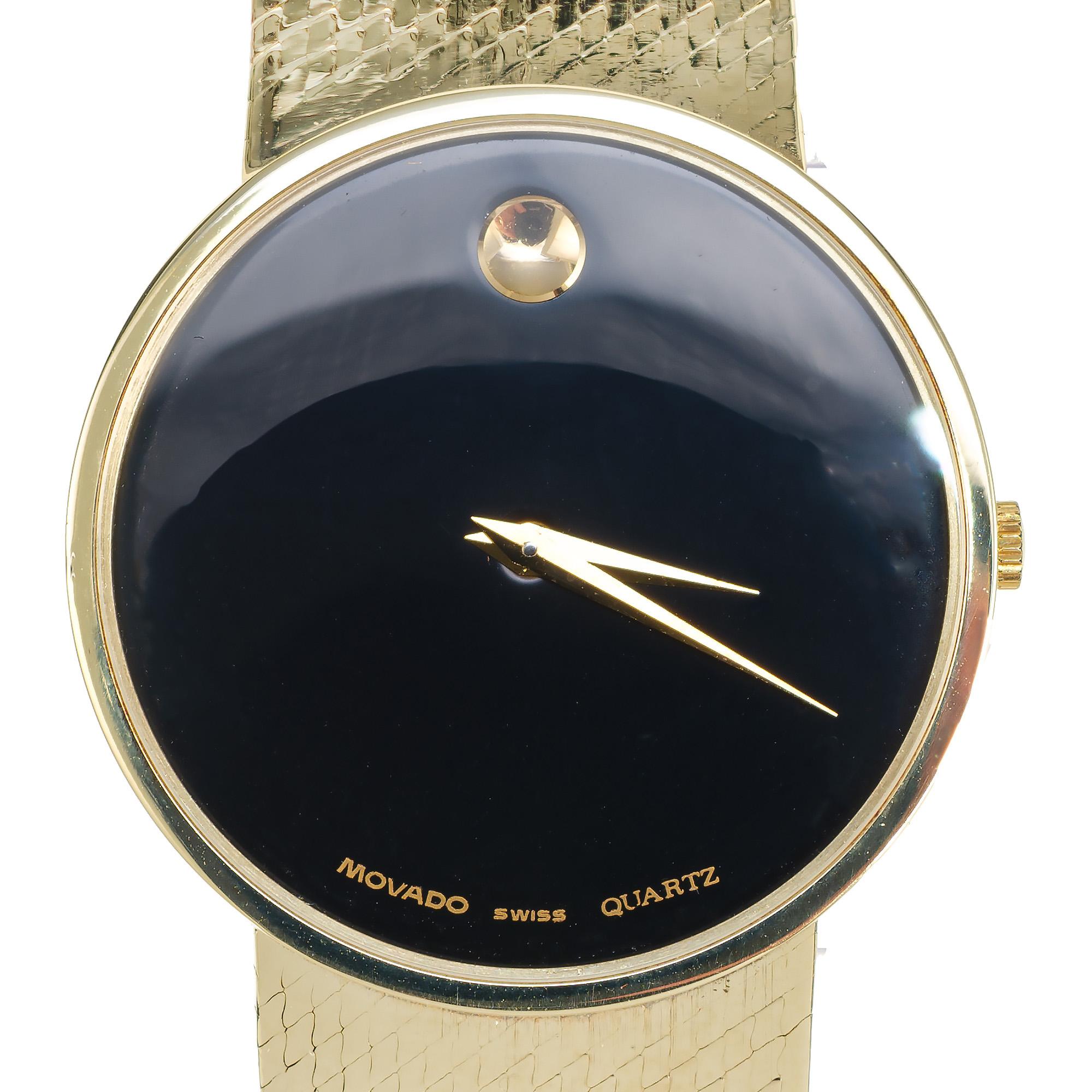 Restored 30mm unisex solid 14k 1990's Movado museum watch, all original with 14k mesh band. No repairs or defects. Comes with a one year service warranty. 

Length: 30.23mm
Width: 30.23mm
Band width at case: 18mm
Case thickness: 4.43mm
Band: 14k
