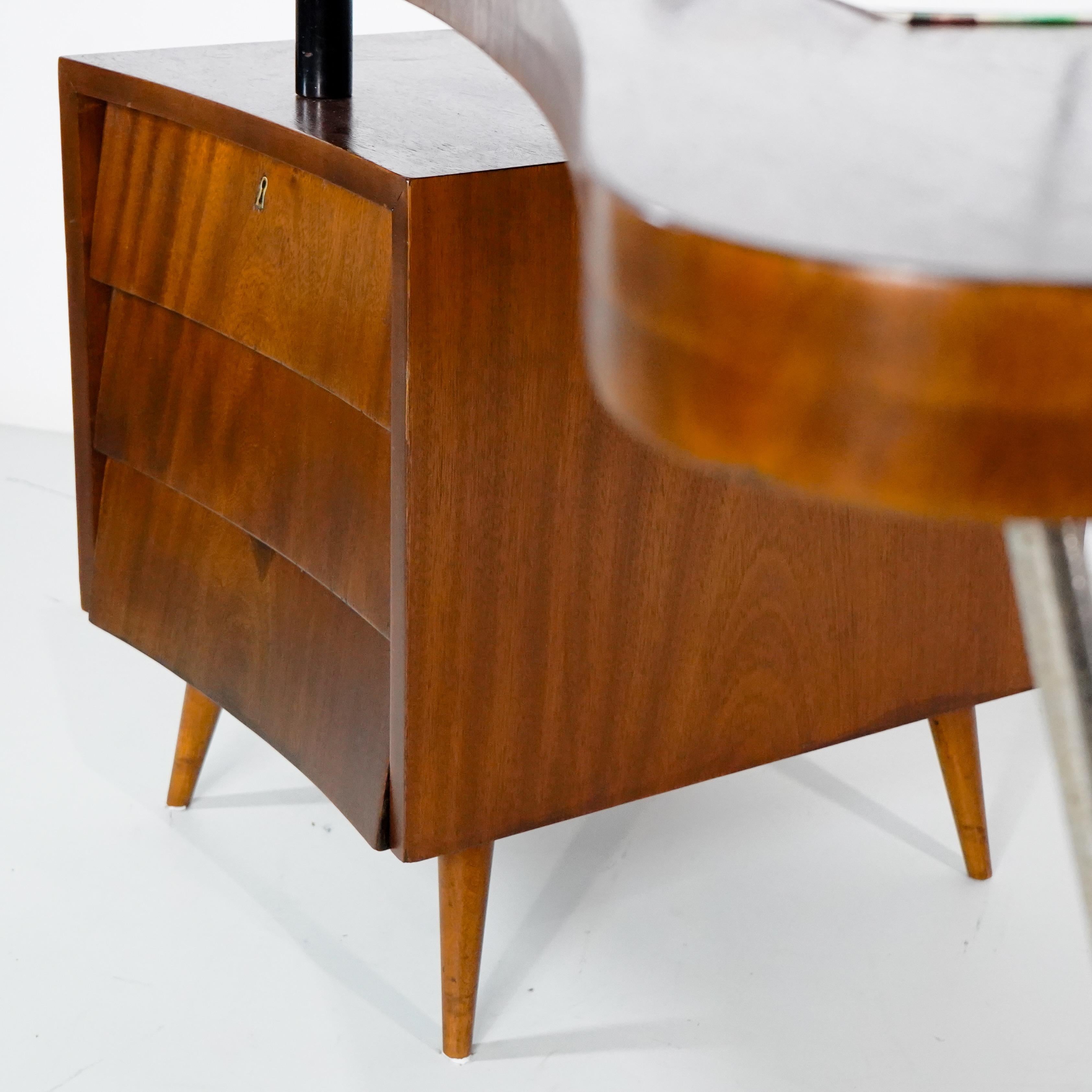 Móveis Cimo - 1960, desk with filing cabinet, Brazil 1960.

The highest historical reference in Brazilian furniture design, Companhia Industrial de Móveis, nicknamed Móveis Cimo, was first created to reuse walnut leftovers from the family sawmill