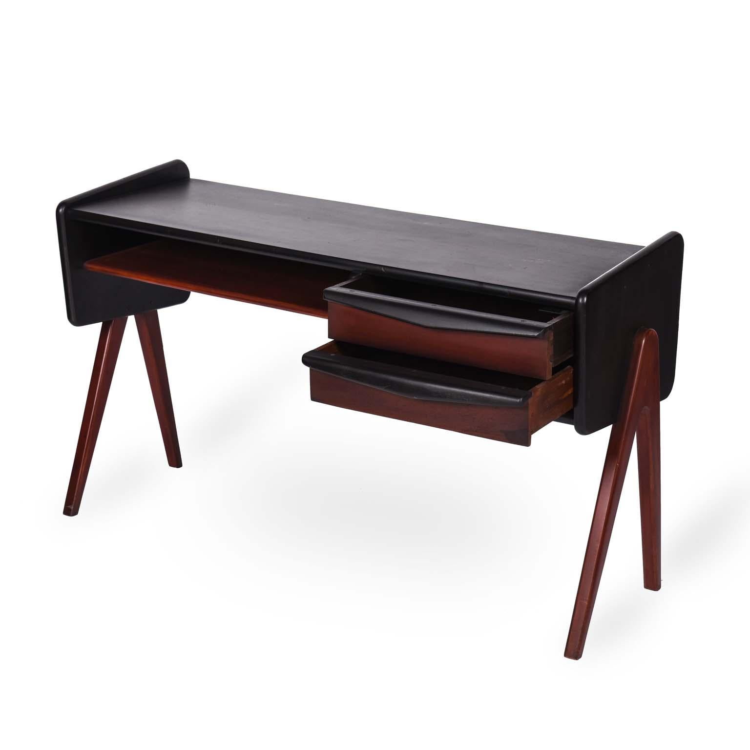 Móveis Cimo midcentury Brazilian desk table, 1960s.

Constructed of lacquered wood in two colors, this beautiful desk has ample workspace and two drawers for storage.
It still preserves the original manufacture stamp at the bottom.