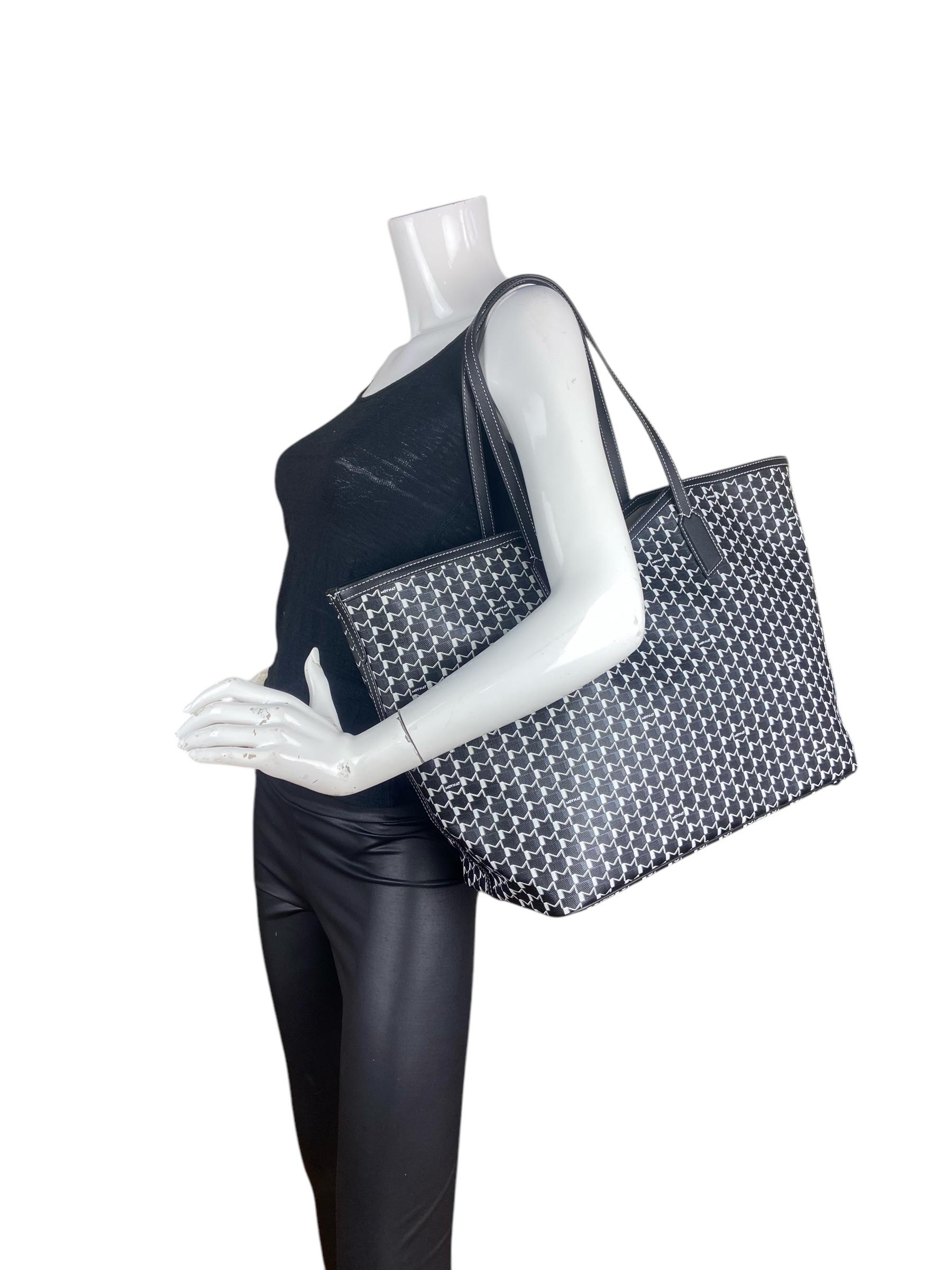 Moynat Black/White Canvas M GM Tote Bag w/ Insert. The Canvas M is carefully elaborated in a natural and non-stretched cotton-linen blend that makes it resistant and durable over time

Made In: Italy
Year of Prodution: 2024
Color: Black and