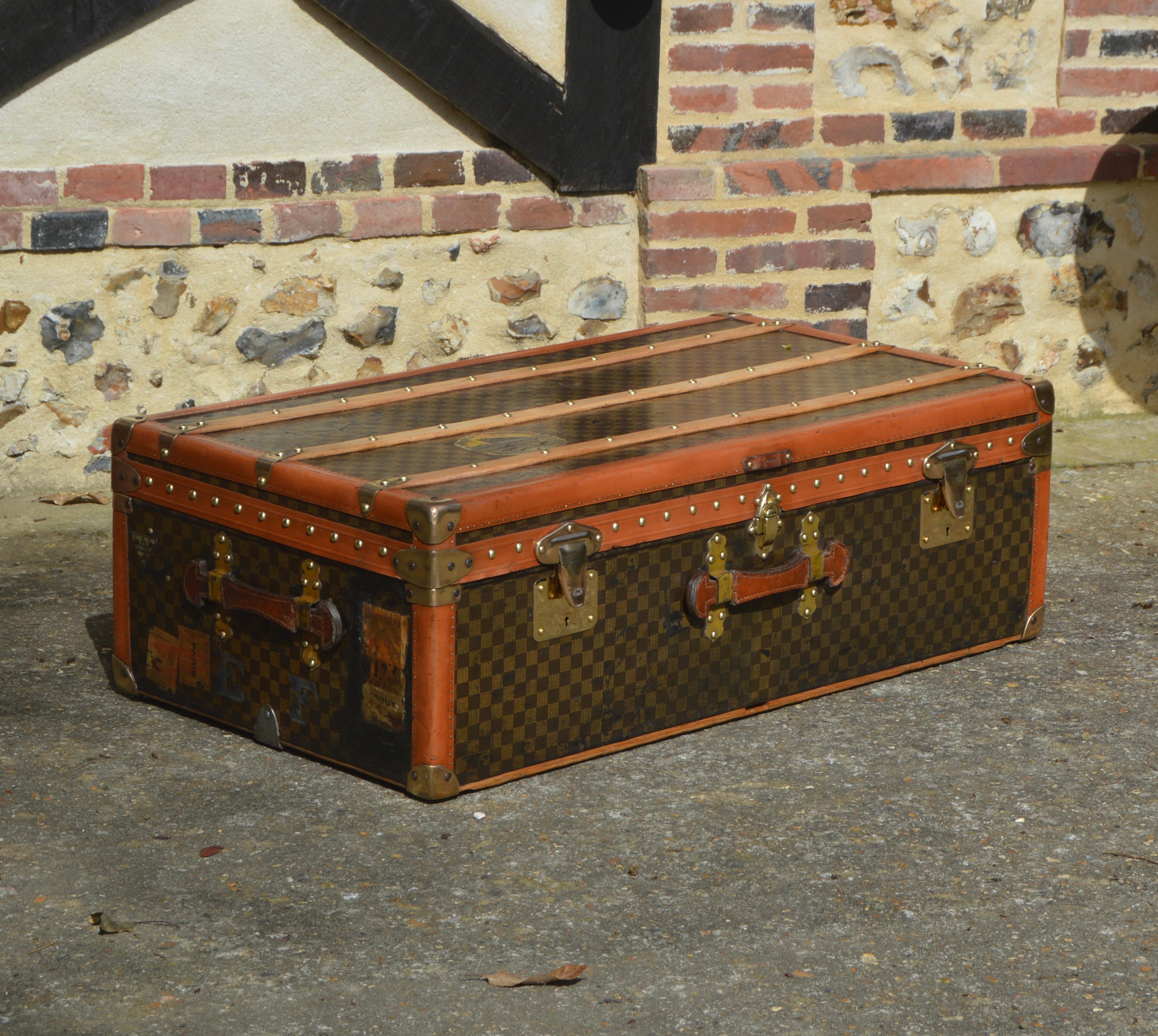 Superb Moynat cabin trunk from the 1910's, covered with a Damier coated canvas and protected by lozine borders. This trunk is equipped with brass 