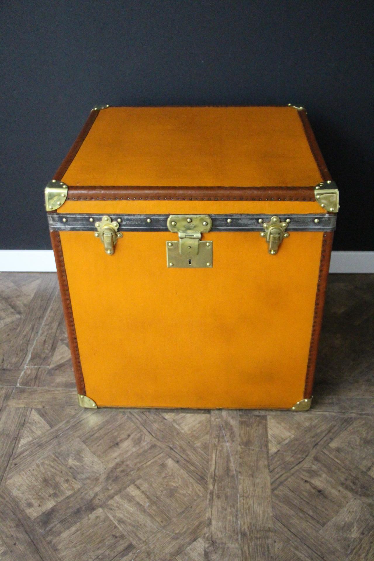 This beautiful and very rare Moynat trunk features beautiful orange canvas, chocolate color leather trim, large leather side handles with stamped Moynat flanges and solid brass stamped Moynat lock. Its patina is magnificent. It still has got Moynat
