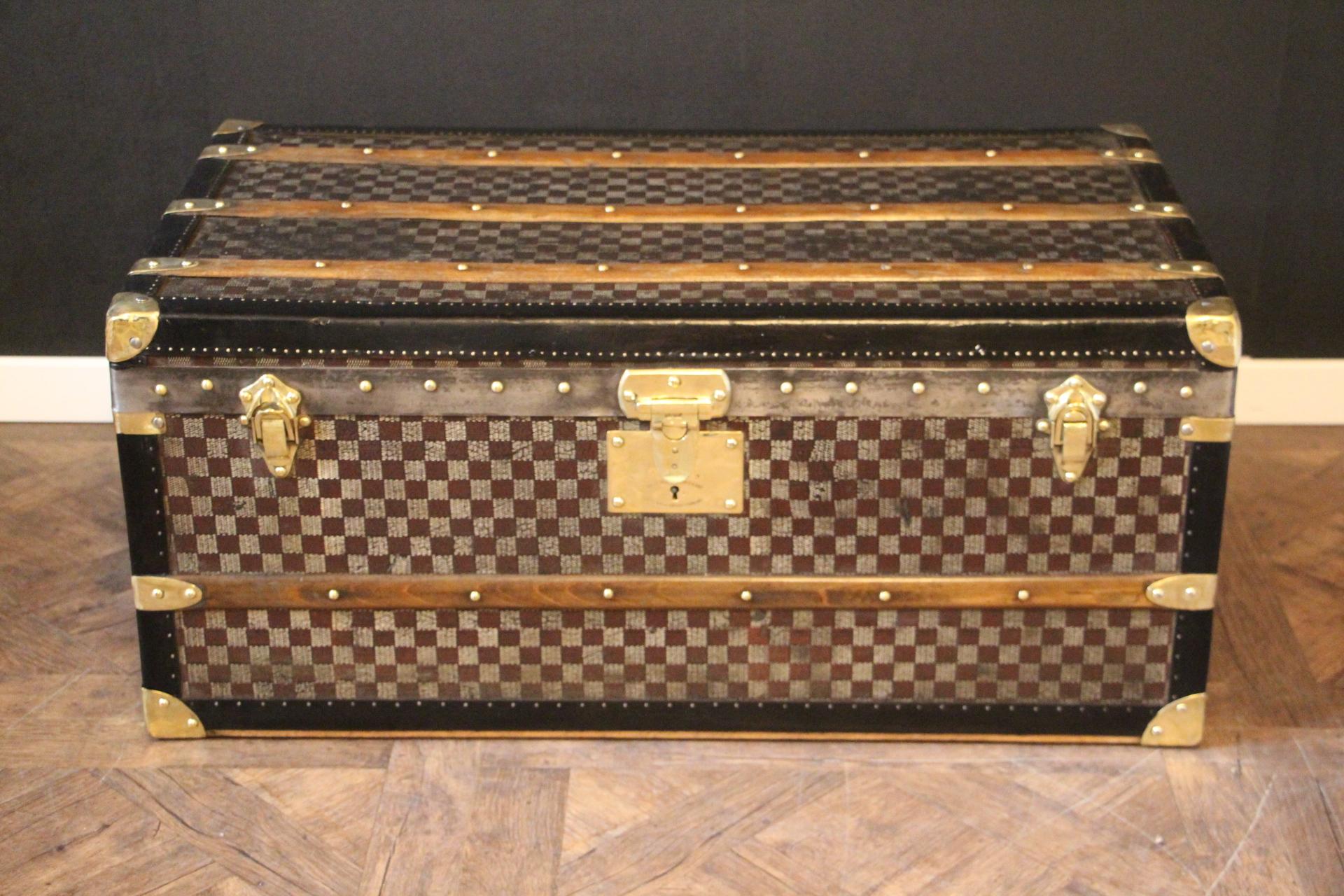 This Moynat steamer trunk features the very nice black and grey 