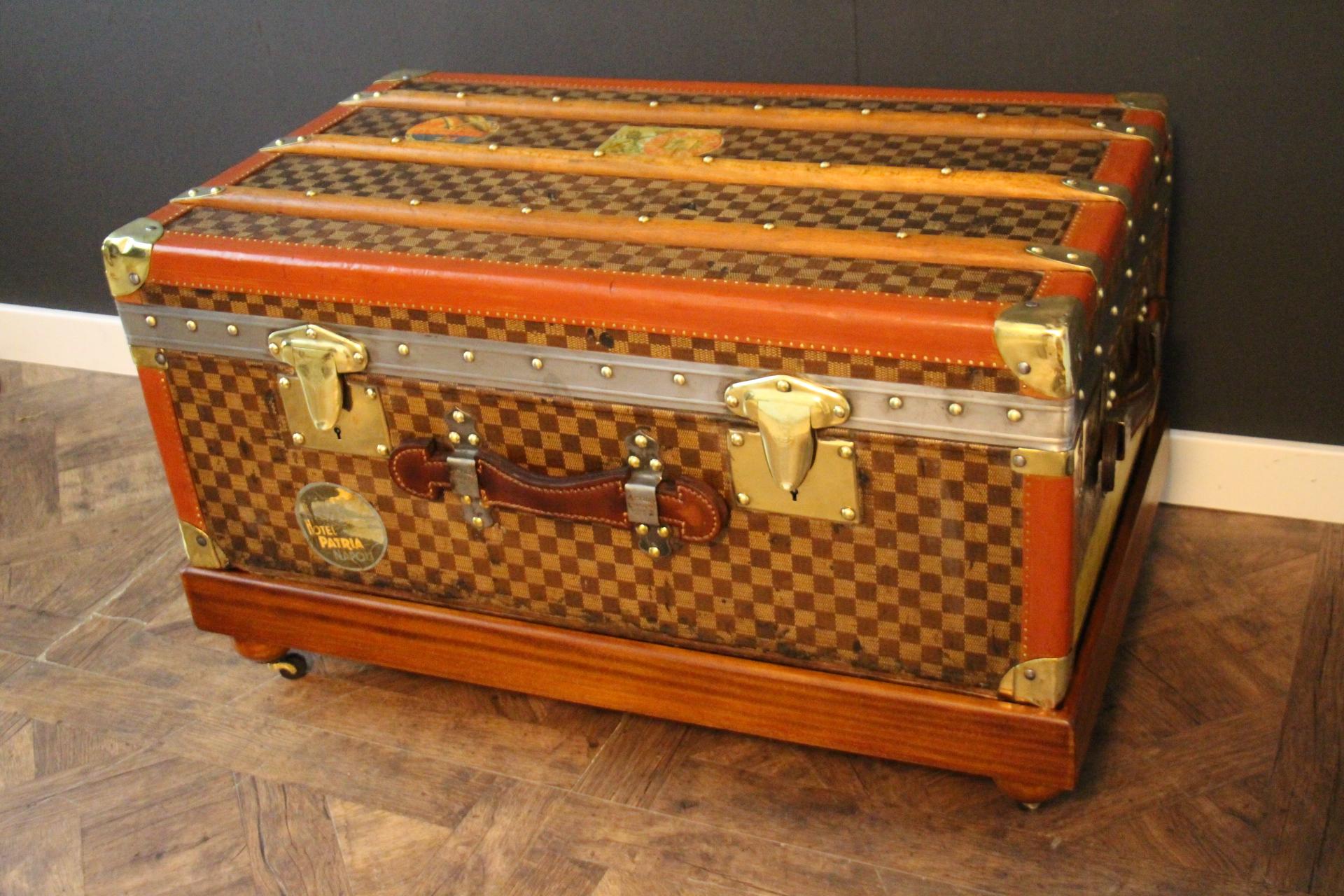 This Moynat steamer trunk features the very nice black and grey 