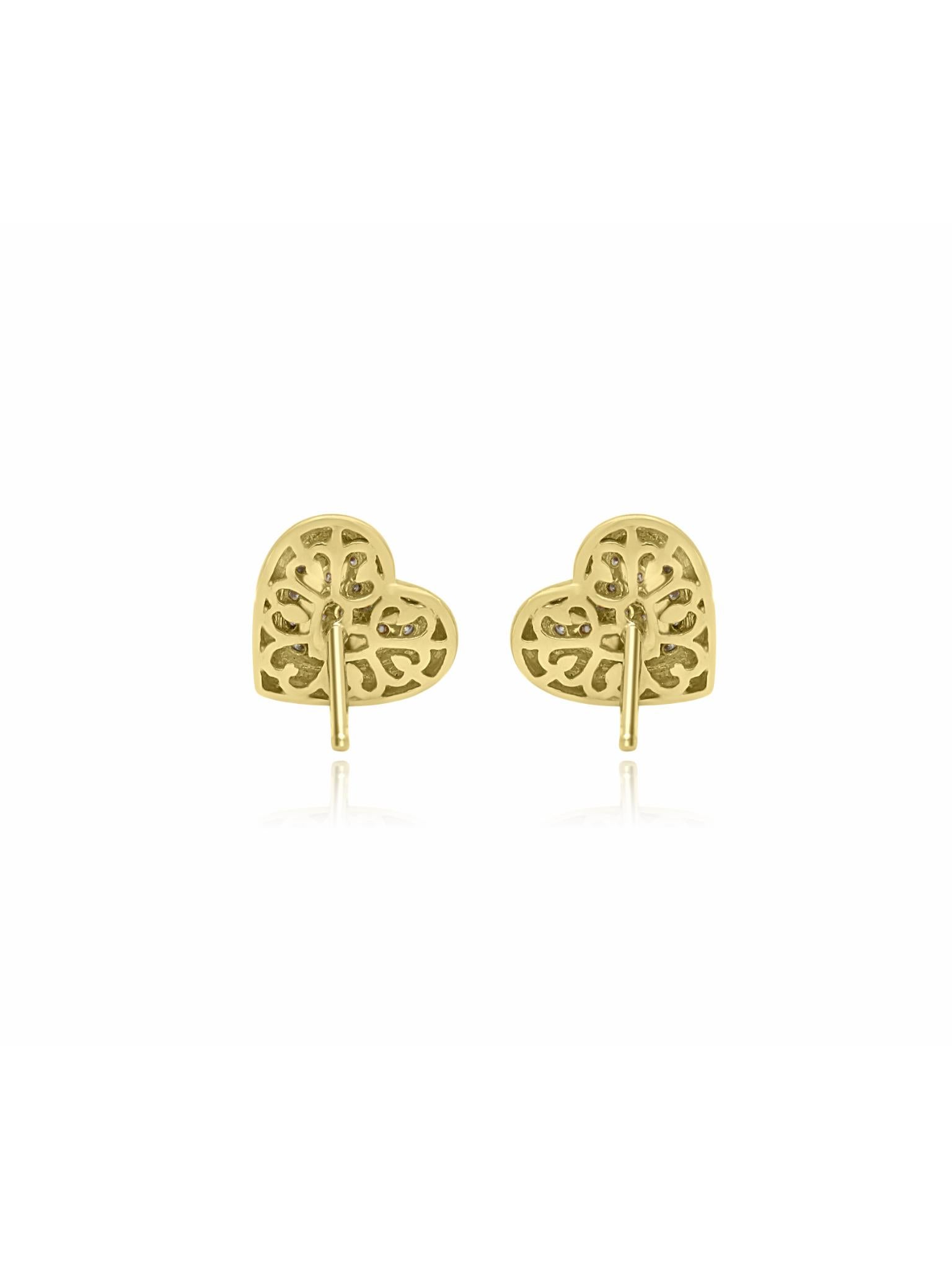 Mozafarian's exquisite gold heart-shaped earrings embellished with glittering diamonds in a heart arrangement. The back of the earrings showcases an intricate art design in gold. A stunning pair of earrings suitable for all occasions.

All