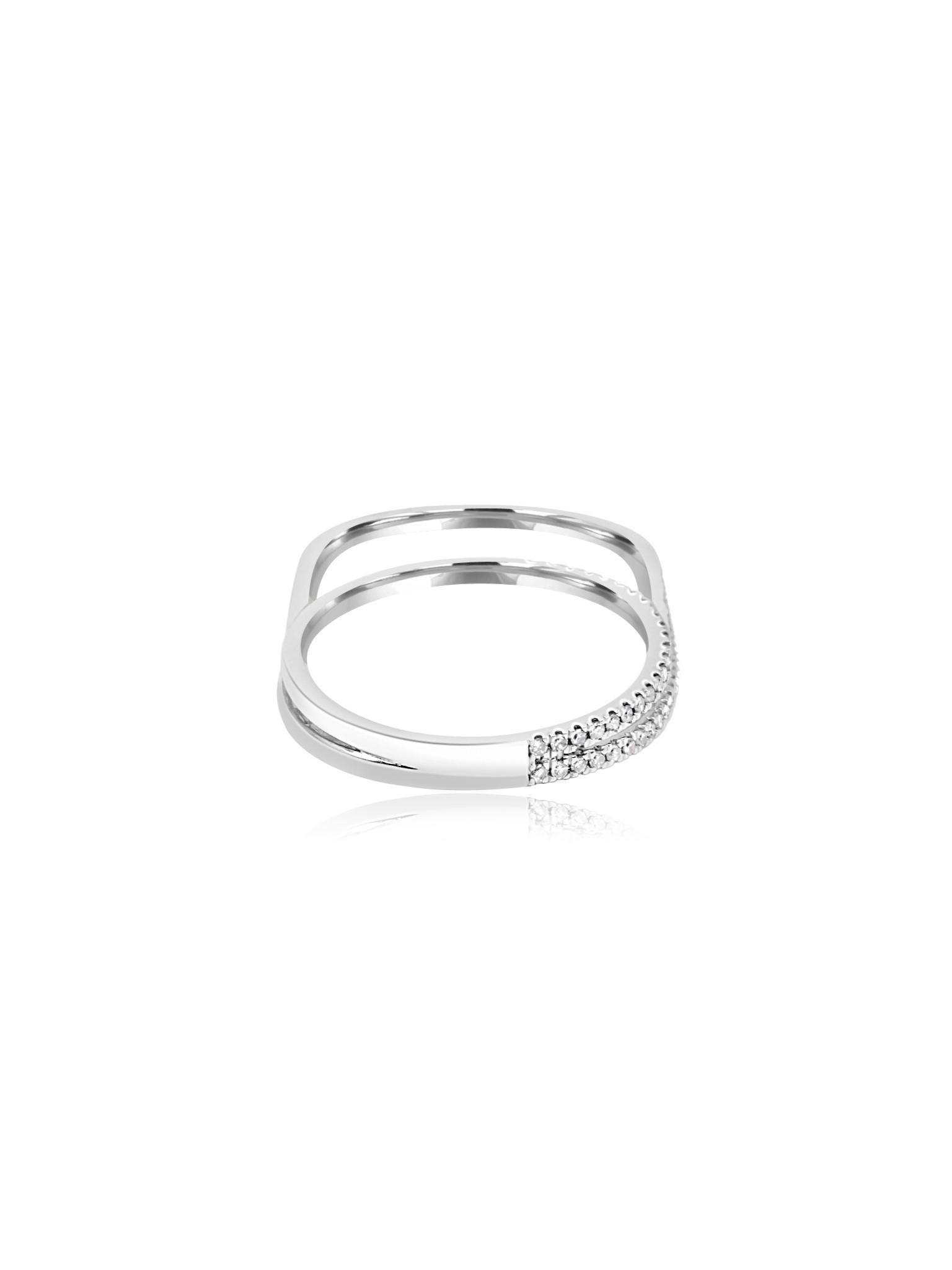 Breathtaking 18 karat white gold dual-finger ring, featuring a sleek design with a continuous row of shimmering round-cut diamonds totaling 0.23 carats. The modern silhouette is both elegant and refined, with diamonds adding a touch of brilliance