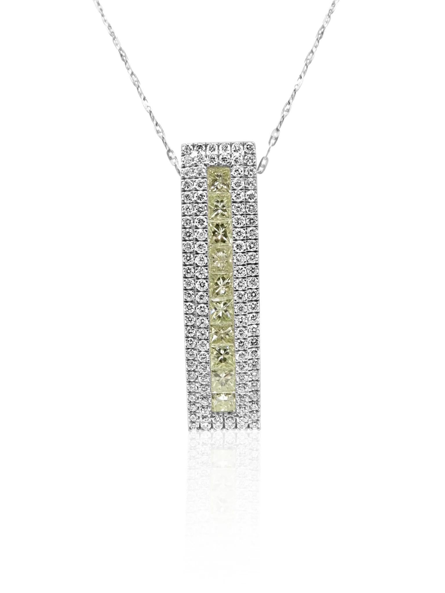 Mozafarian 18 karat white gold necklace featuring a long pendant adorned with diamonds in various colors, with a subtle touch of yellow at the center for a distinctive and vibrant look. Matching earrings are available at an additional cost to