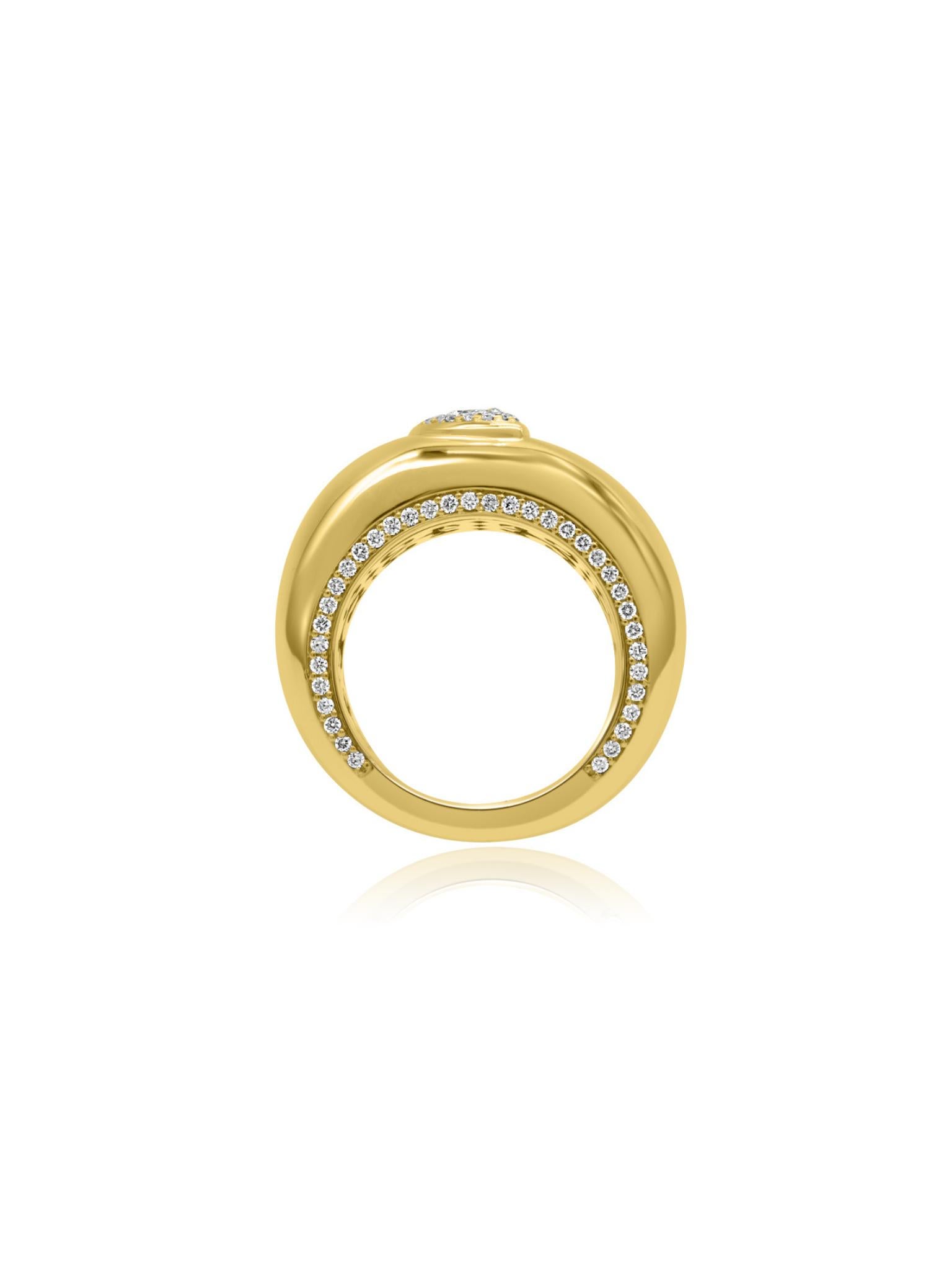 Mozafarian's 18 karat gold ring featuring small round cut diamonds arranged in a marquise shape at the centre, while additional diamonds adorn the edges of the ring. The inside of the band showcases intricately carved art. Perfect statement