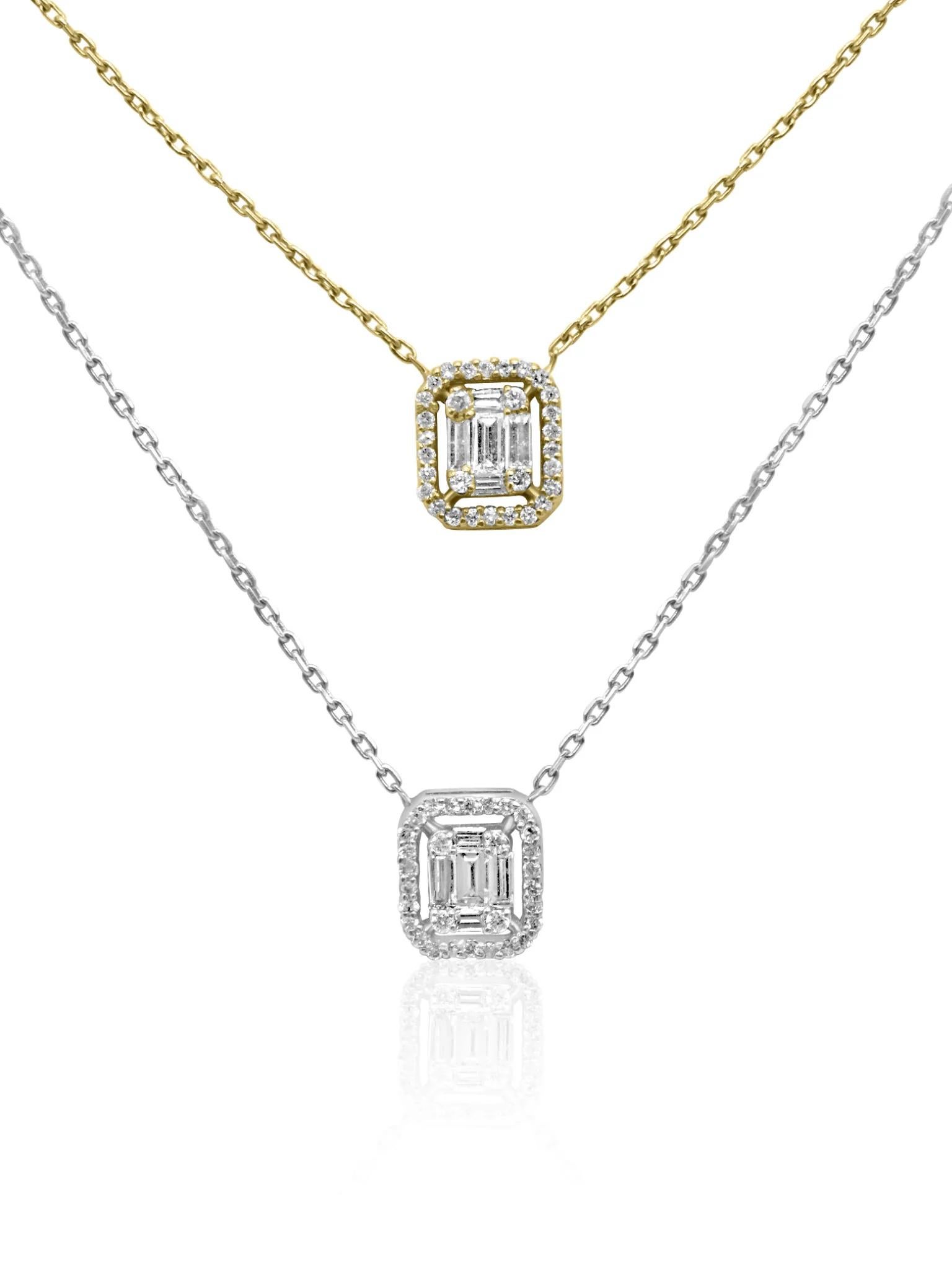 Réalisé dans un mélange harmonieux d'or blanc et d'or jaune 18 carats, ce collier exquis met en valeur deux pendentifs élégamment conçus, chacun drapé d'un éblouissant éventail de diamants étincelants. Un diamant unique orne chaque côté, ajoutant un