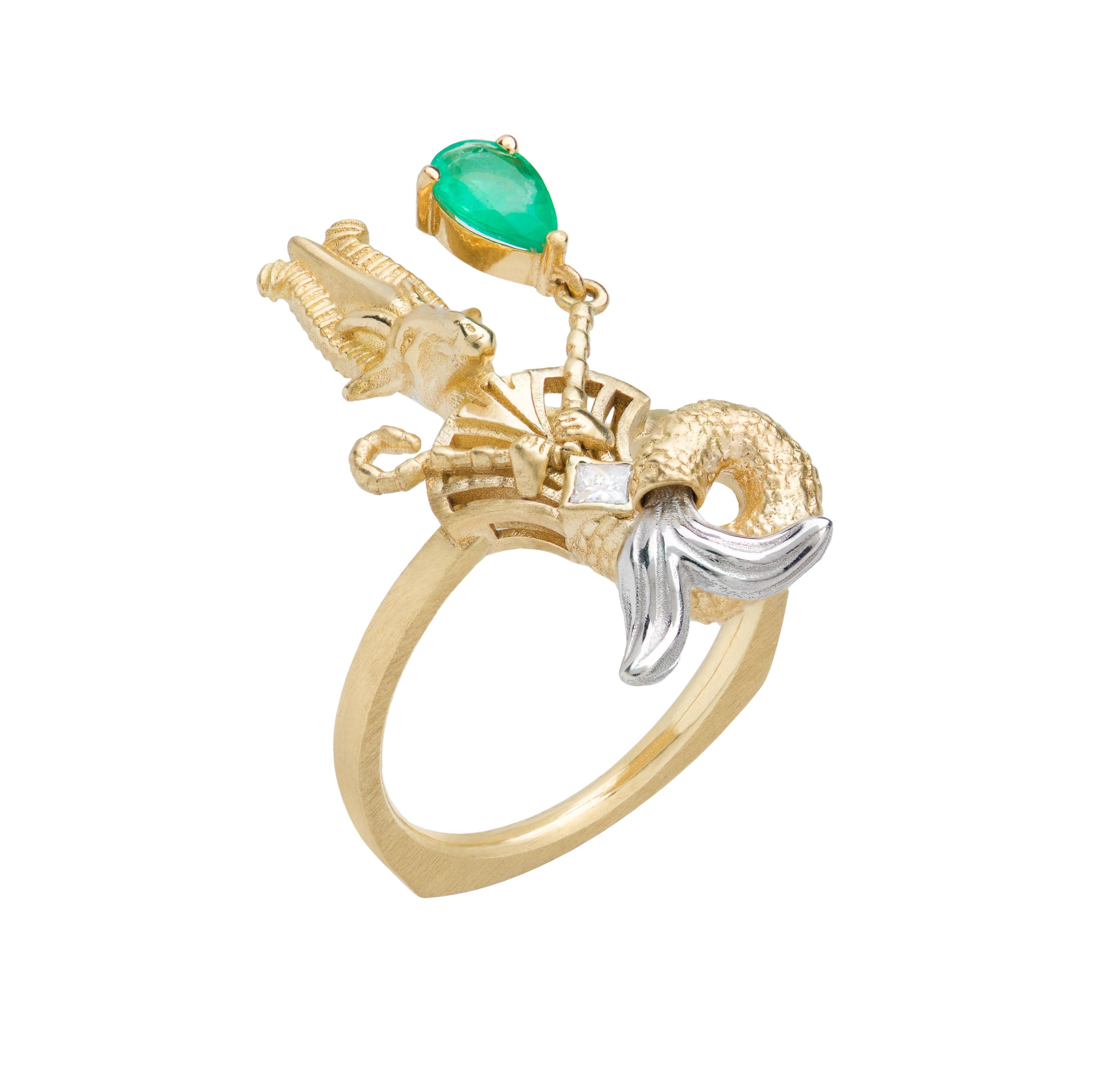 A collaboration between Mozafarian and Katarina Tarazi, the Capricorn Ring honors Osiris, the father of all Ancient Egyptian gods. 

This refined piece features a 0.06 ct princess-cut white diamond and a 0.45 ct pear-shaped emerald, set in 18k