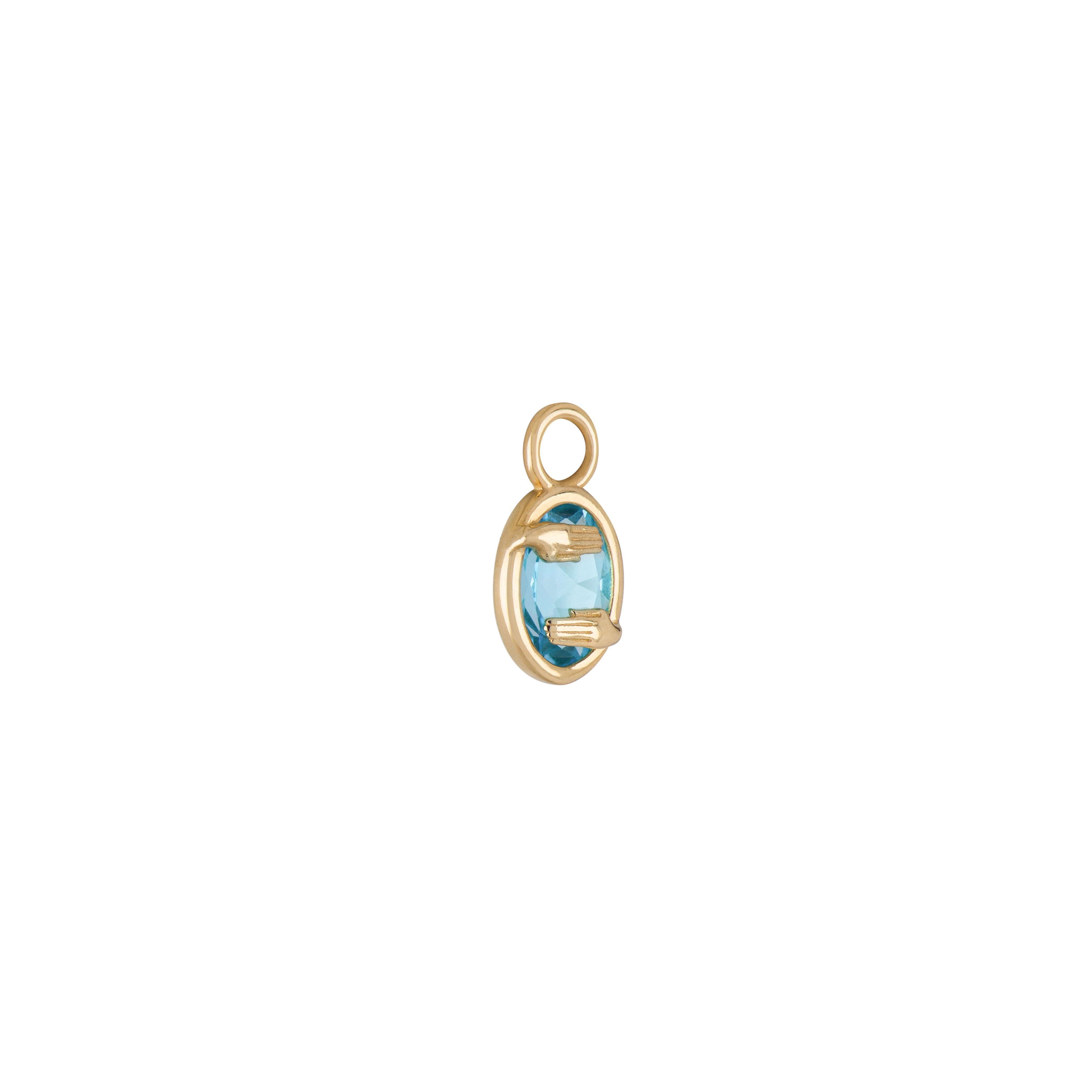 A collaboration between Mozafarian and Katarina Tarazi, the Gemini Capsule Pendant embodies Ka, the Ancient Egyptian dual-spirit hieroglyph.

This piece features a Swiss blue topaz, set in 18k yellow gold, with a total weight of 1.3 g.

The pendant