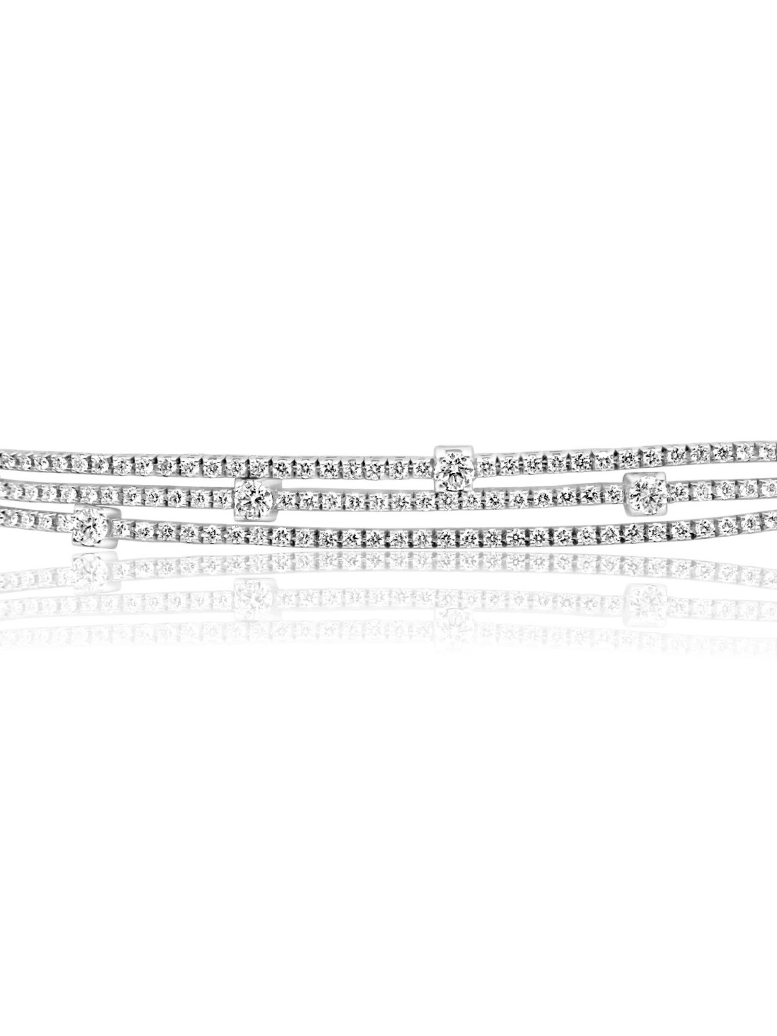 Luxurious Diamond Layered Tennis Bracelet crafted from 18 karat white gold and adorned with mesmerising diamonds, this bracelet exudes elegance and sophistication. The addition of larger diamonds adds a unique touch to this already breathtaking