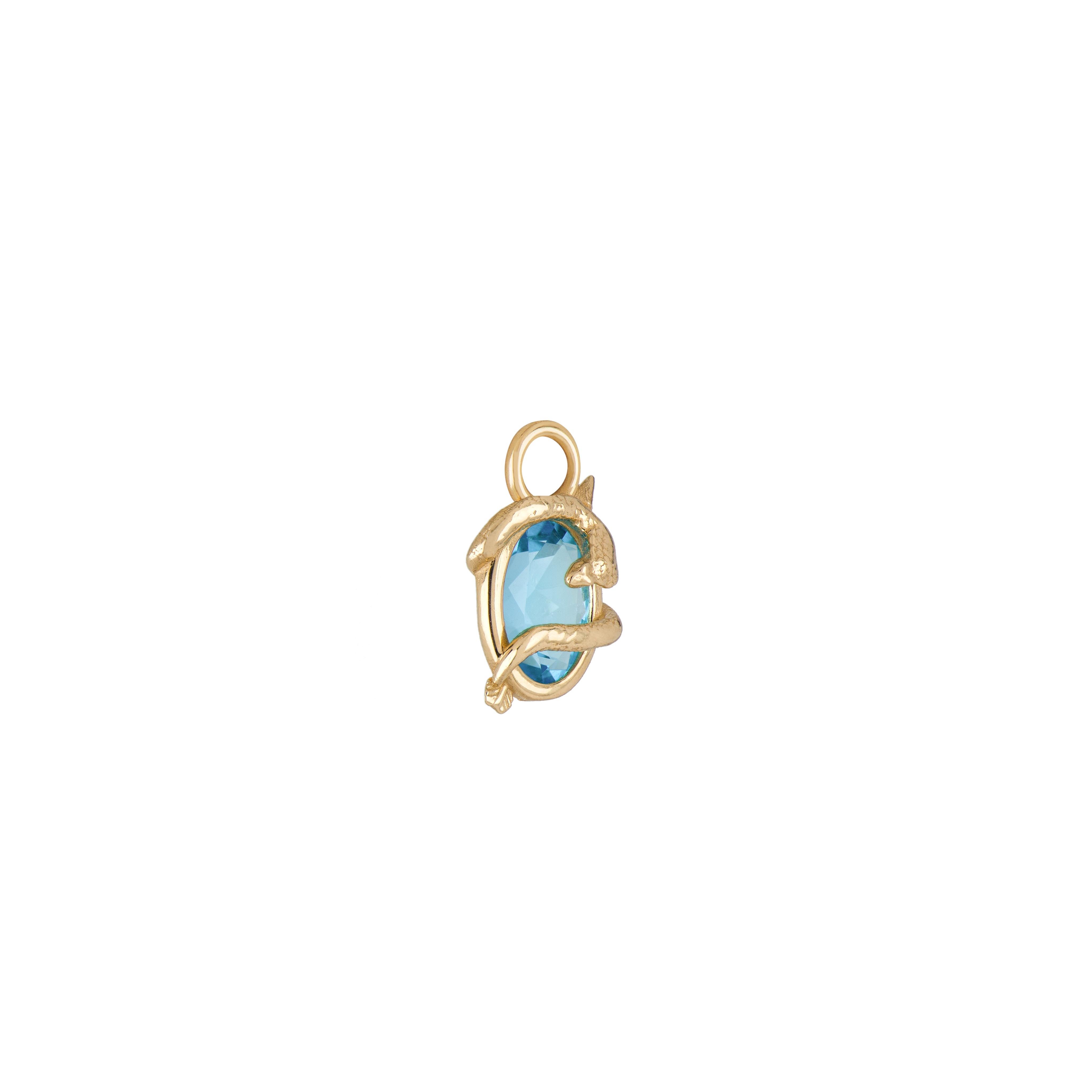 A collaboration between Mozafarian and Katarina Tarazi, the Sagittarius Capsule Pendant embodies the arrow with a cobra, the Egyptian symbol of power.

This refined piece features a Swiss blue topaz, set in 18k yellow gold, with a total weight of