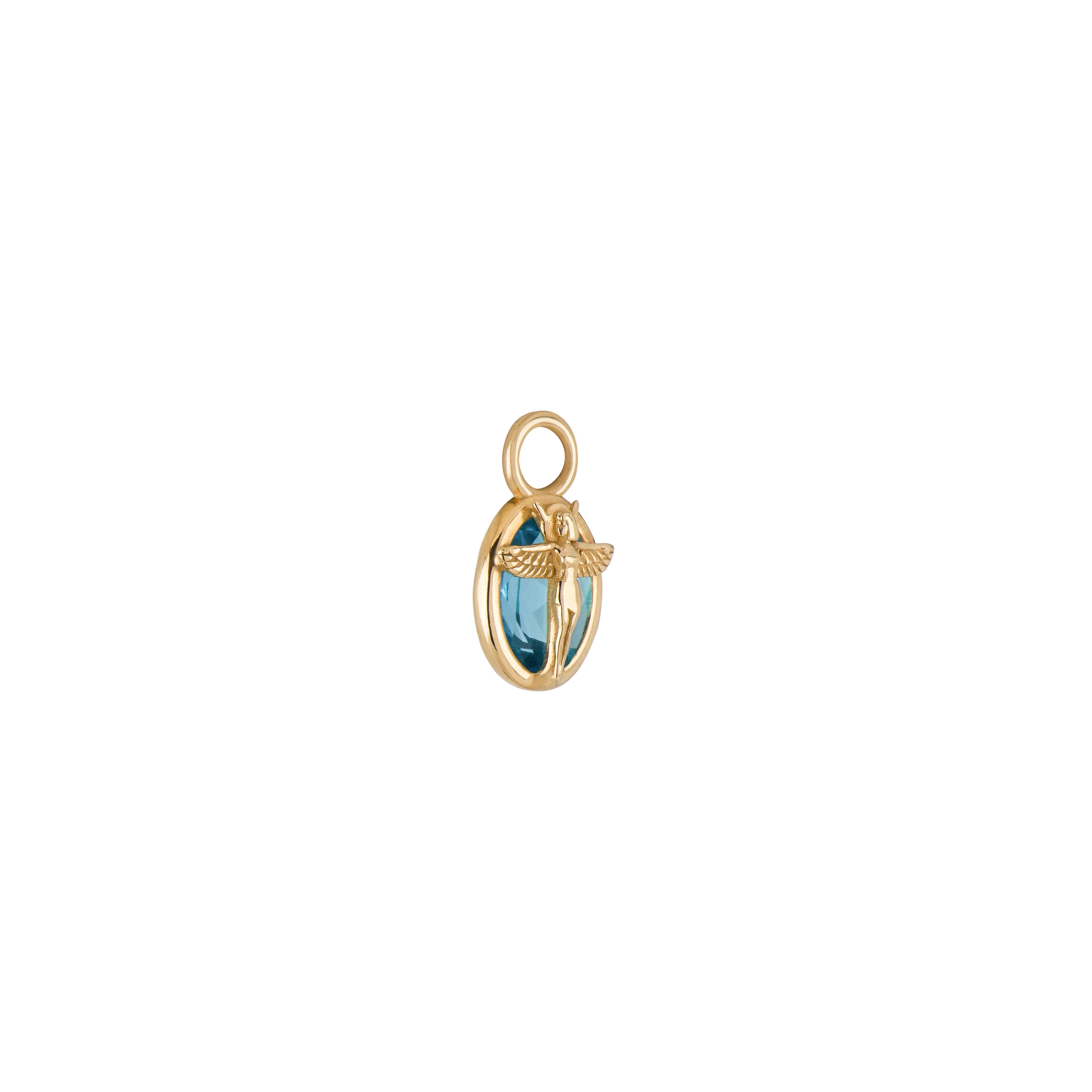 Frutto della collaborazione tra Mozafarian e Katarina Tarazi, il ciondolo Virgo Capsule incarna Iside, l'antica madre egizia di tutti gli dei.

Questo pezzo presenta un topazio blu svizzero, incastonato in oro giallo 18 carati, con un peso totale di