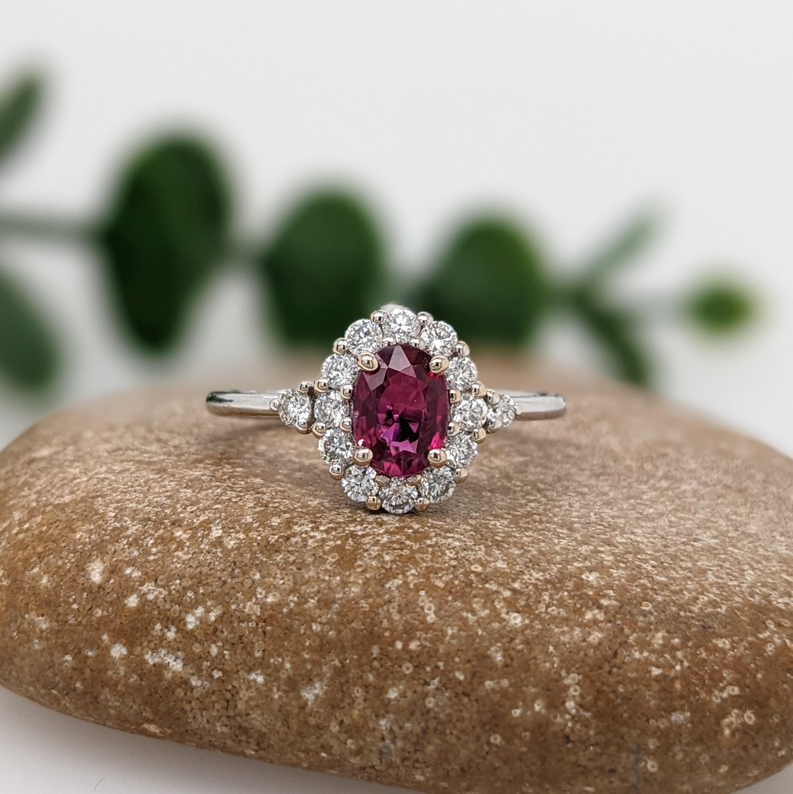 This gorgeous red ruby comes from Mozambique and looks stunning in a classic NNJ Design's setting with a halo of natural diamonds and a tapered shank. A polished design that looks good on anyone! Pair this gorgeous ruby with with any outfit of your