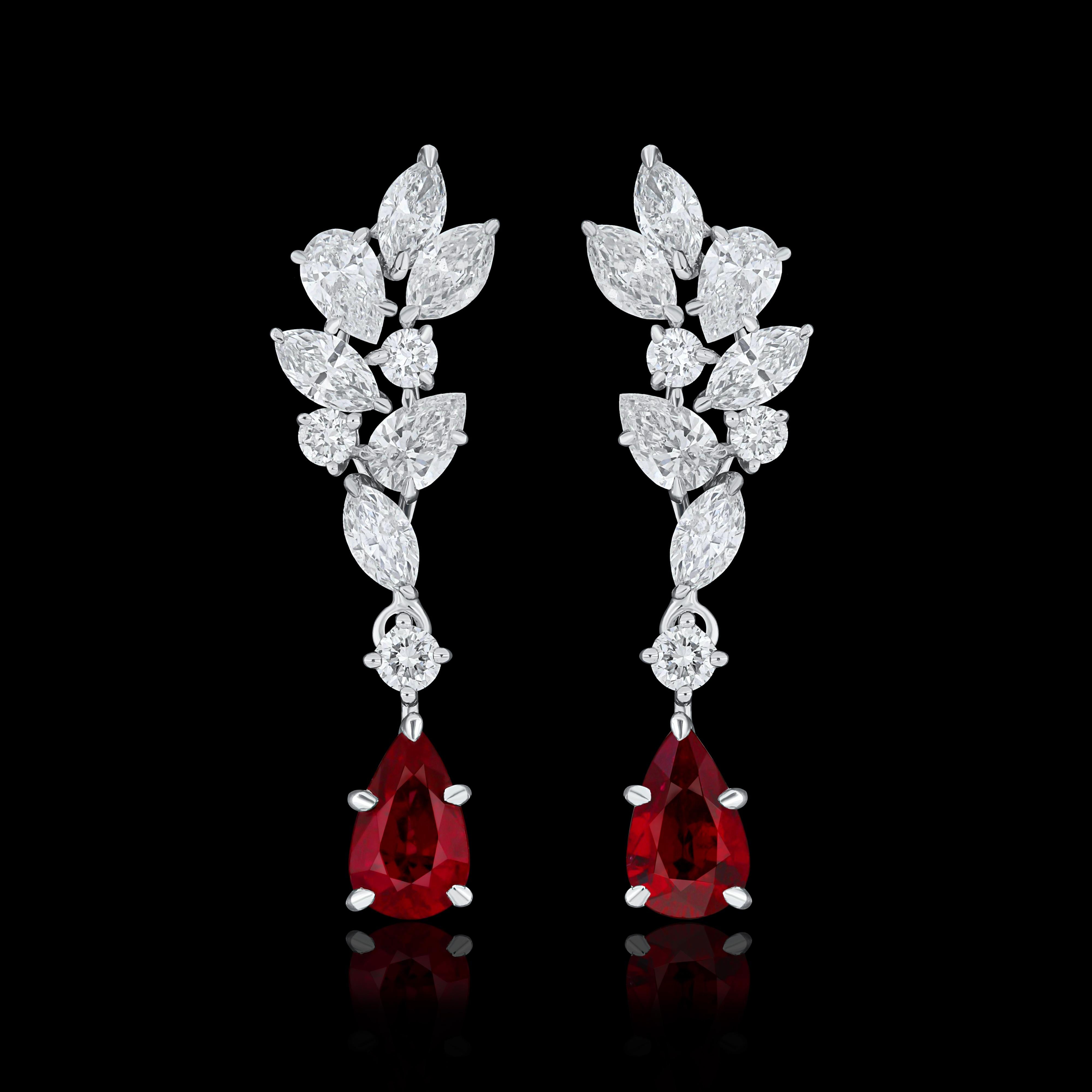 Elegant and exquisitely detailed 18 Karat White Gold Earring, center set with 0.71 Cts .Pear Shape Ruby Mozambique and micro pave set Diamonds, weighing approx. 0.98 Cts Beautifully Hand crafted in 18 Karat White Gold.

Stone Detail:
Ruby