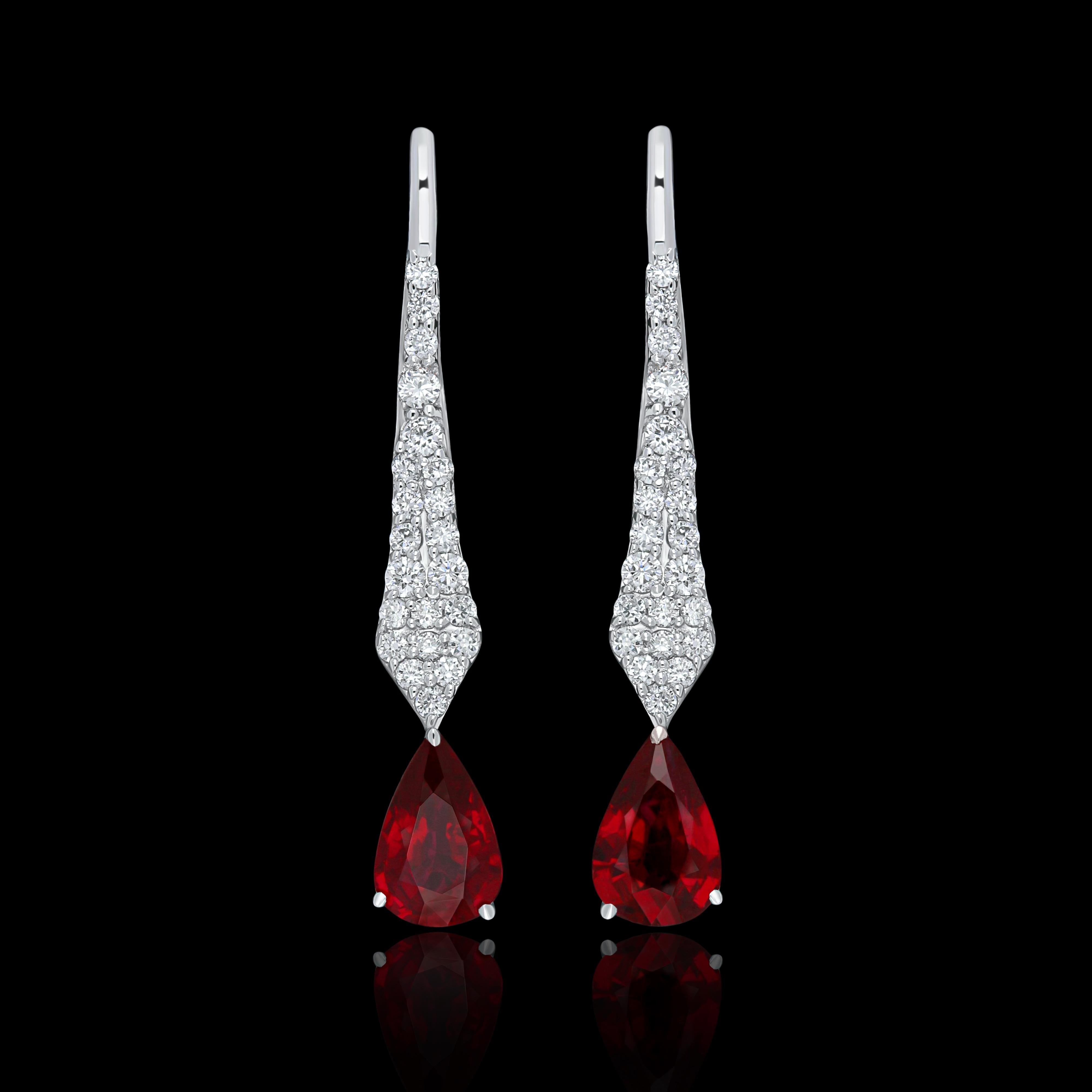 Elegant and exquisitely detailed 18 Karat White Gold Earrings, set with 0.77Cts .Pear Shape vibrant Red Mozambique Ruby and micro pave set Diamonds, weighing approx. 0.22Cts Beautifully Hand crafted in 18 Karat White Gold.

Stone Detail:
Ruby
