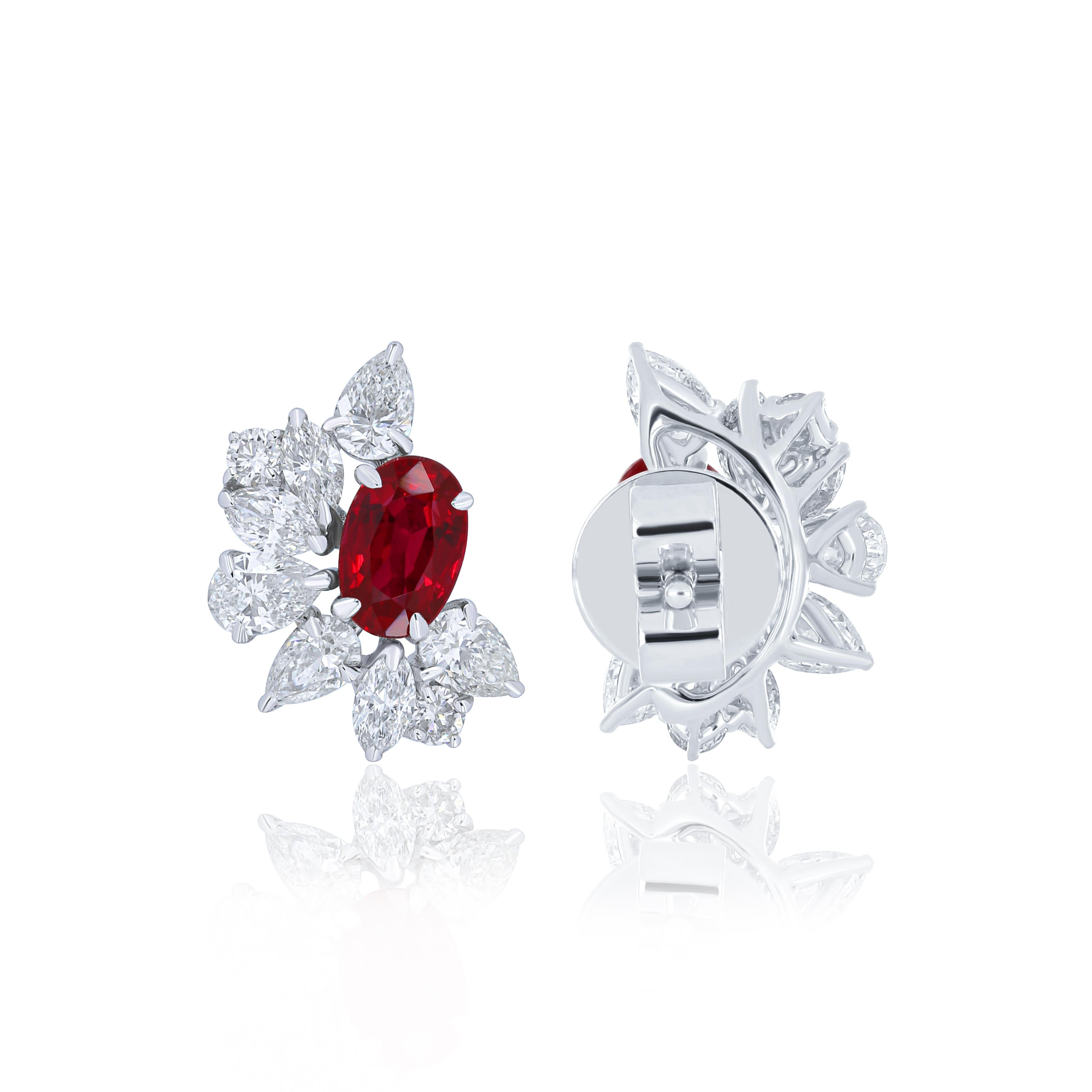 Oval Cut Mozambique Ruby and Diamond Studded Earrings in 18 Karat White Gold For Sale