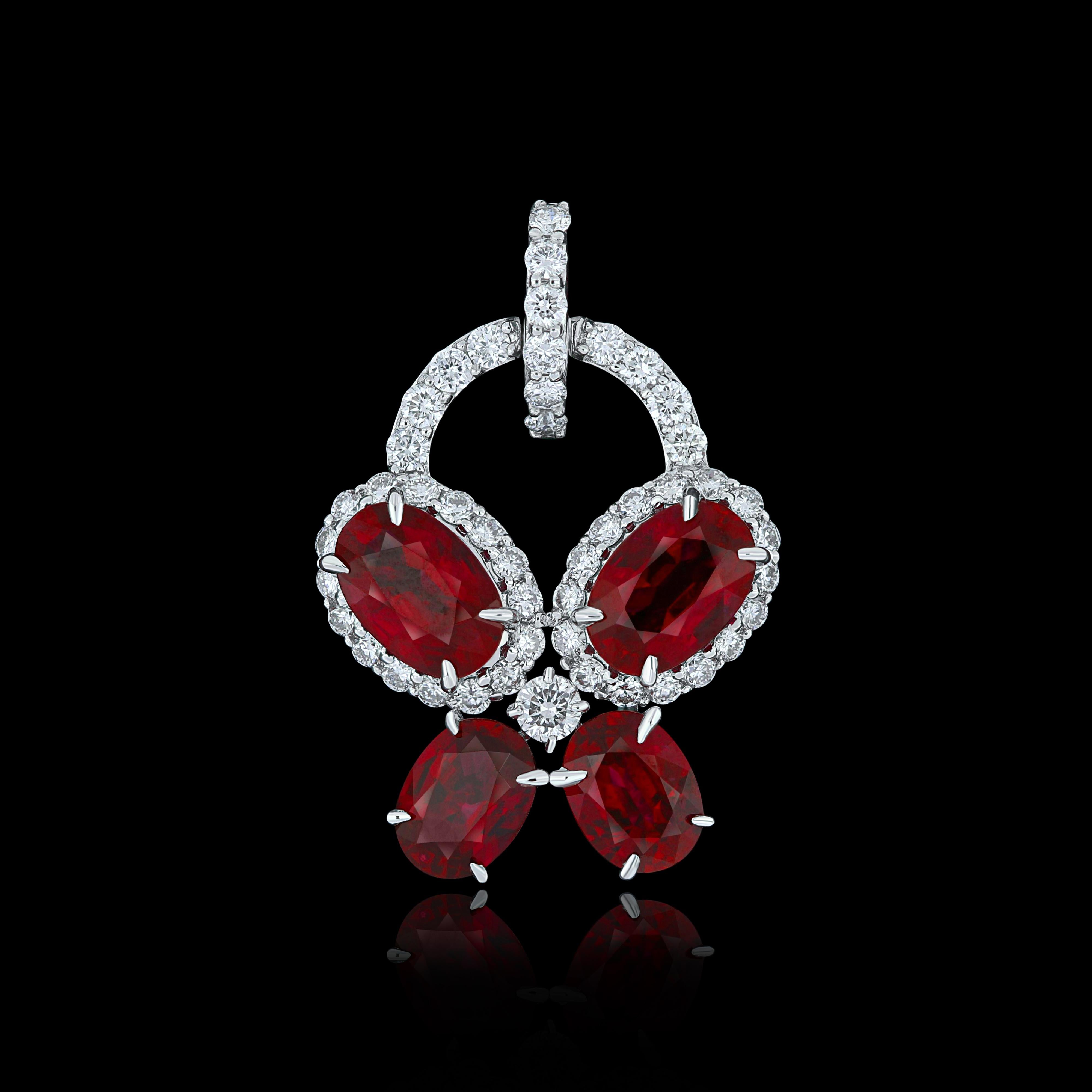 Elegant and exquisitely detailed 18 Karat White Gold Pendant, center set with 1.71 Cts .Oval Shape intense Red Mozambique Ruby  and micro pave set Diamonds, weighing approx. 0.35 Cts Beautifully Hand crafted in 18 Karat White Gold.

Stone