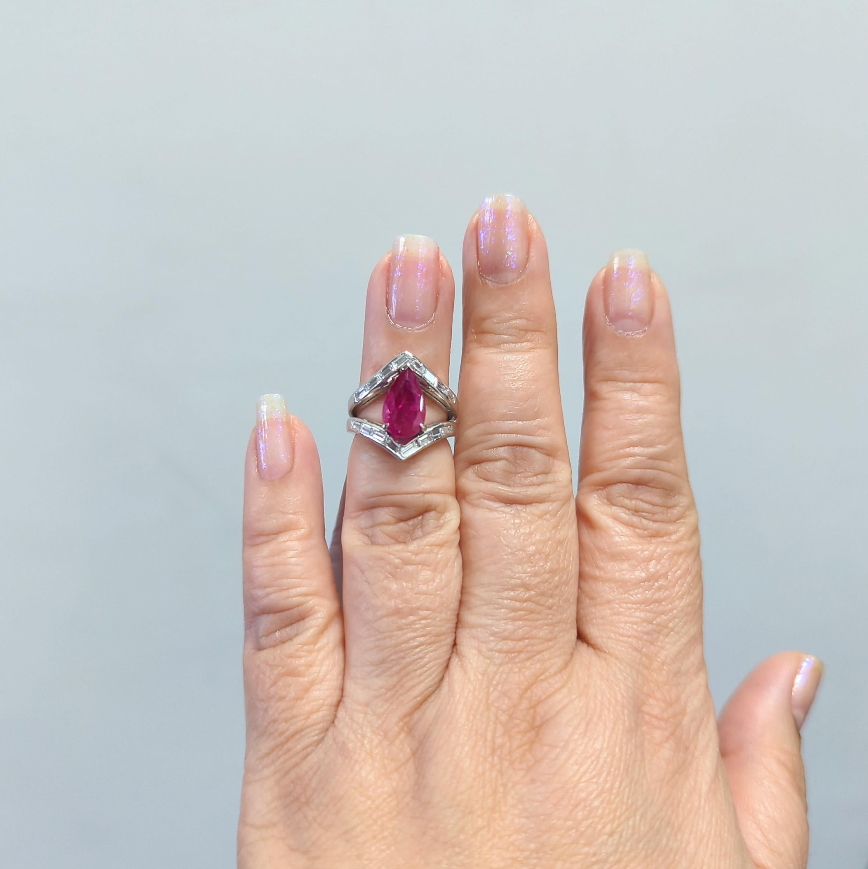 Gorgeous 2.67 ct. deep red Mozambique ruby pear shape with good quality white diamond baguettes.  Handmade in platinum.  Ring size 4.  Ruby is heated.