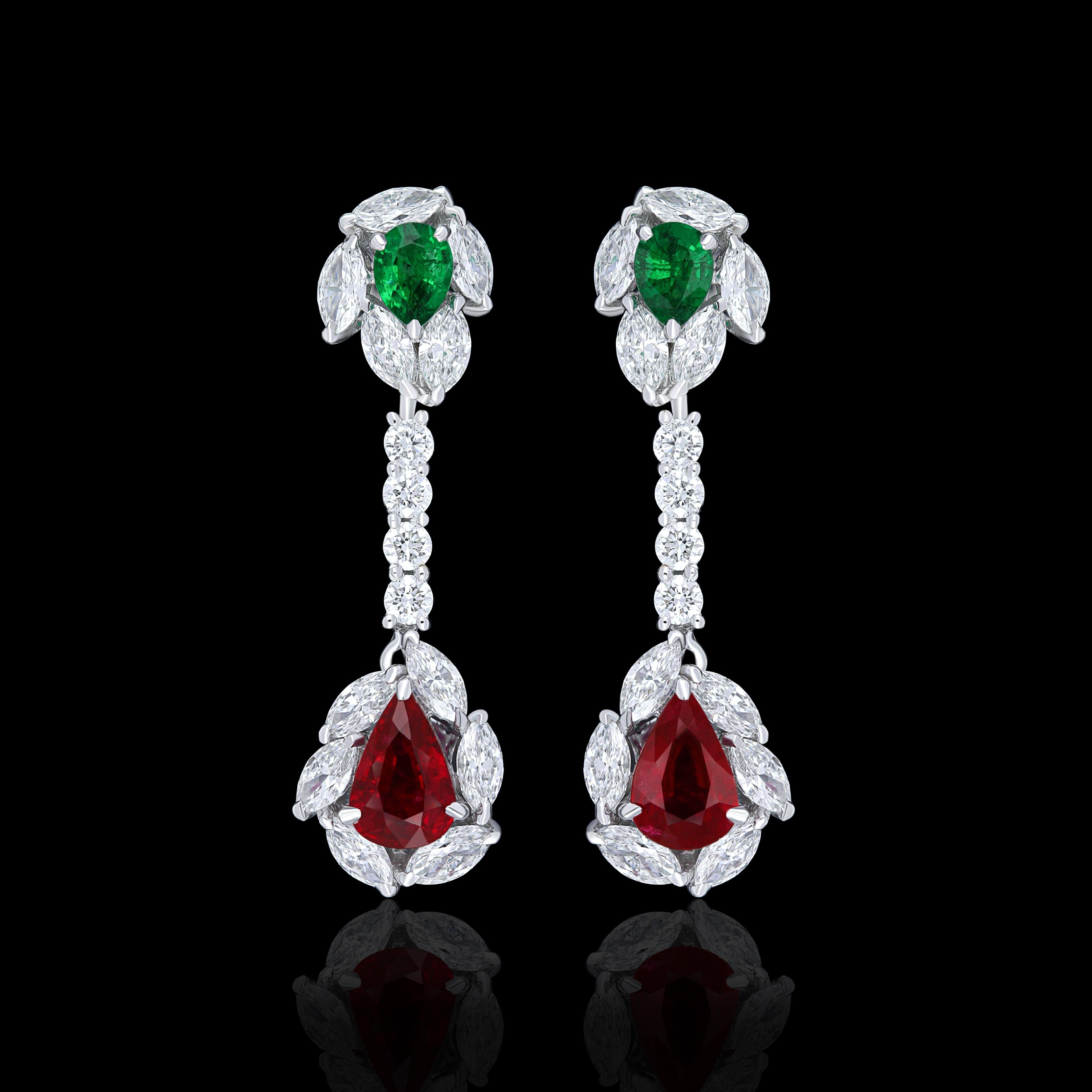 Elegant and exquisitely detailed 18 Karat White Gold Earrings, center set with 0.80Cts .Pear Shape Blood Red Mozambique Ruby and 0.22   Cts of vibrant Emeralds beautifully accented with micro pave set Diamonds, weighing approx. 1.20Cts Beautifully