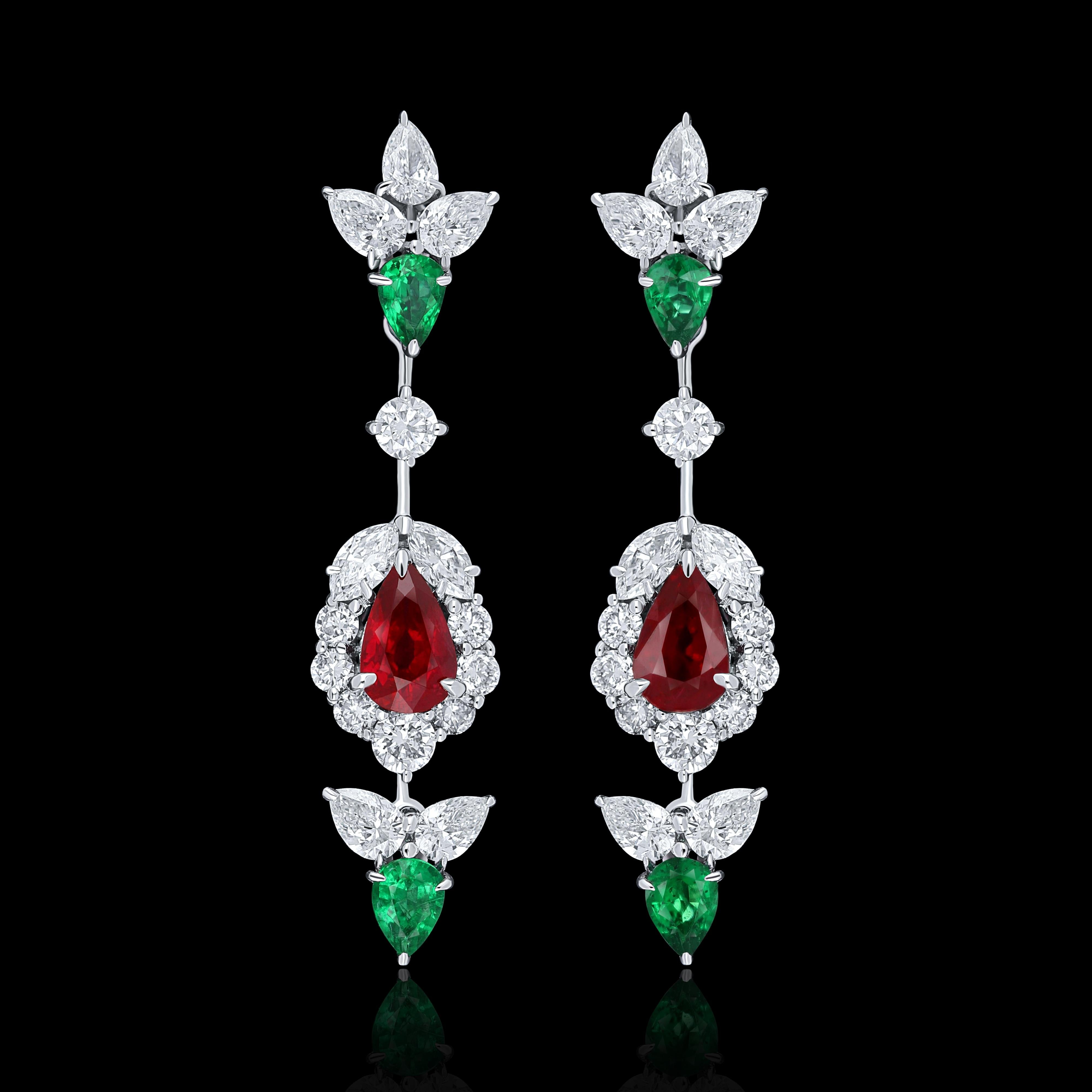 Elegant and exquisitely detailed 18 Karat White Gold Earring, center set with 0.91Cts .Pear Shape intense Red Mozambique Ruby , and 0.45 Cts Vibrant Green Emerald accented with micro pave set Diamonds, weighing approx. 1.57Cts Beautifully Hand