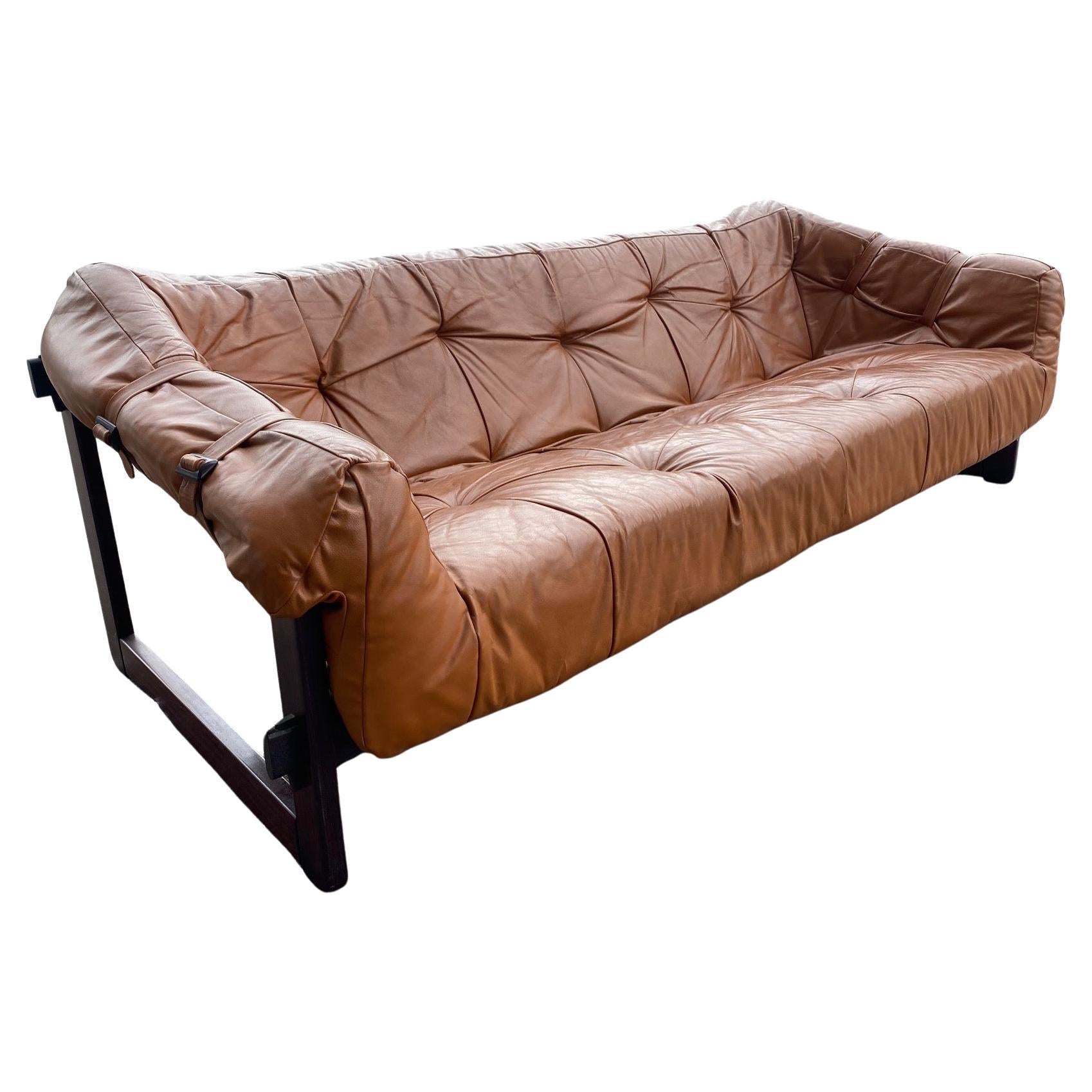 Mid-Century Modern MP-091 3-seater sofa by Percival Lafer in original Brazilian Jacaranda wood and upholstered in original cognac leather. Brazil, 1960s

One of the most original and sculptural works by the Brazilian designer Percival Lafer, who