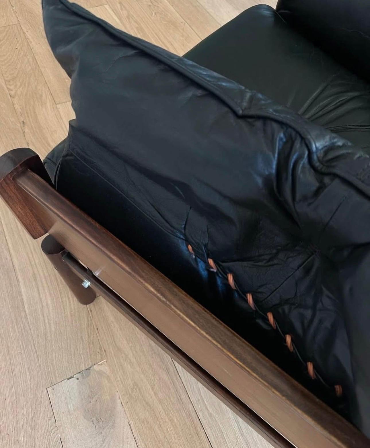 Pair of Percival Lafer MP-13 lounge chairs in its original   Upholstery. Rare opportunity to own a set in black leather! 