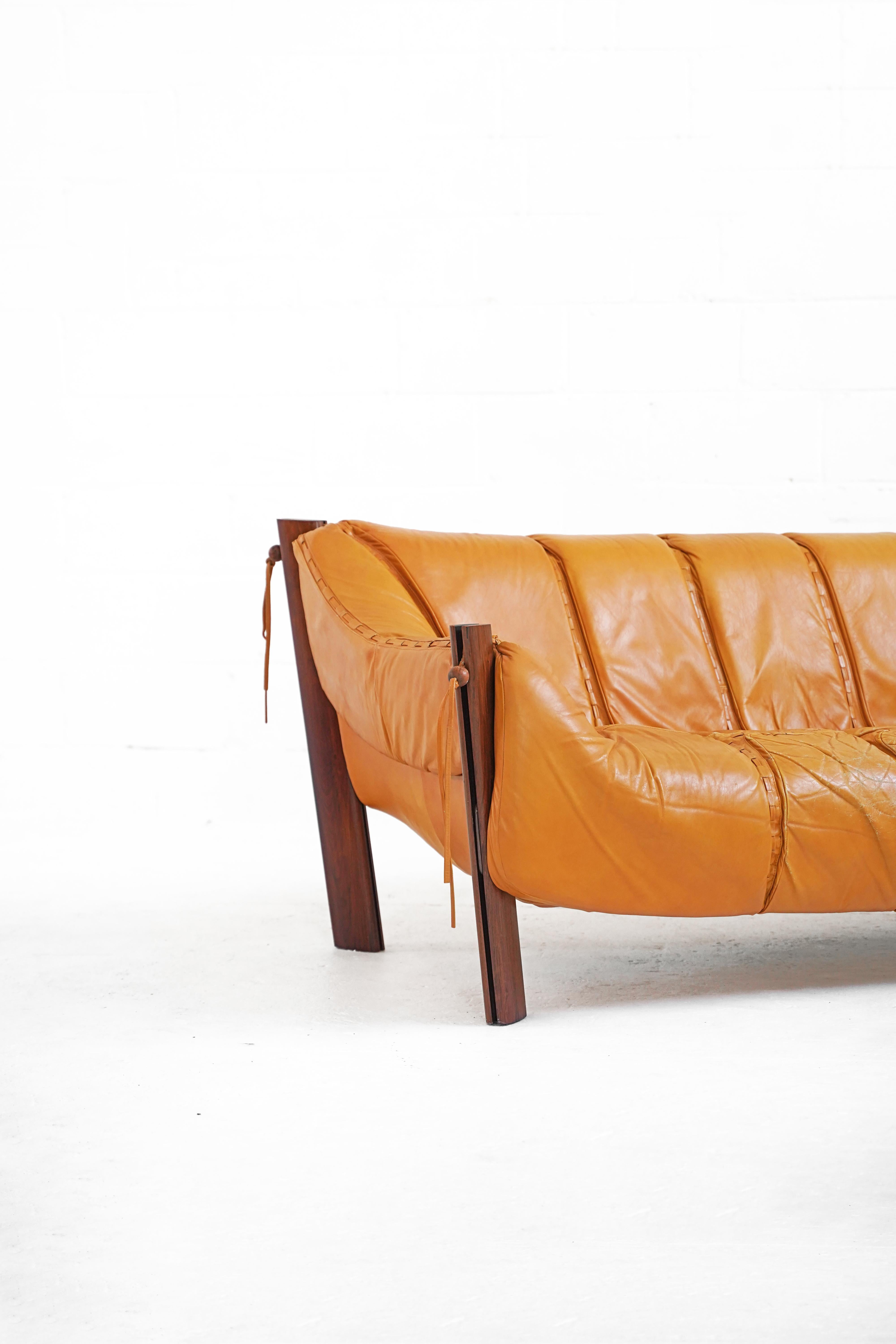 1960-1979 Production. Original leather upholstery in a Tuscany Yellow, with some patina, as photographed. Both the MP-211 sofa and matching lounge chair date to the 60s-70s.

Measurements: 
Sofa: 78