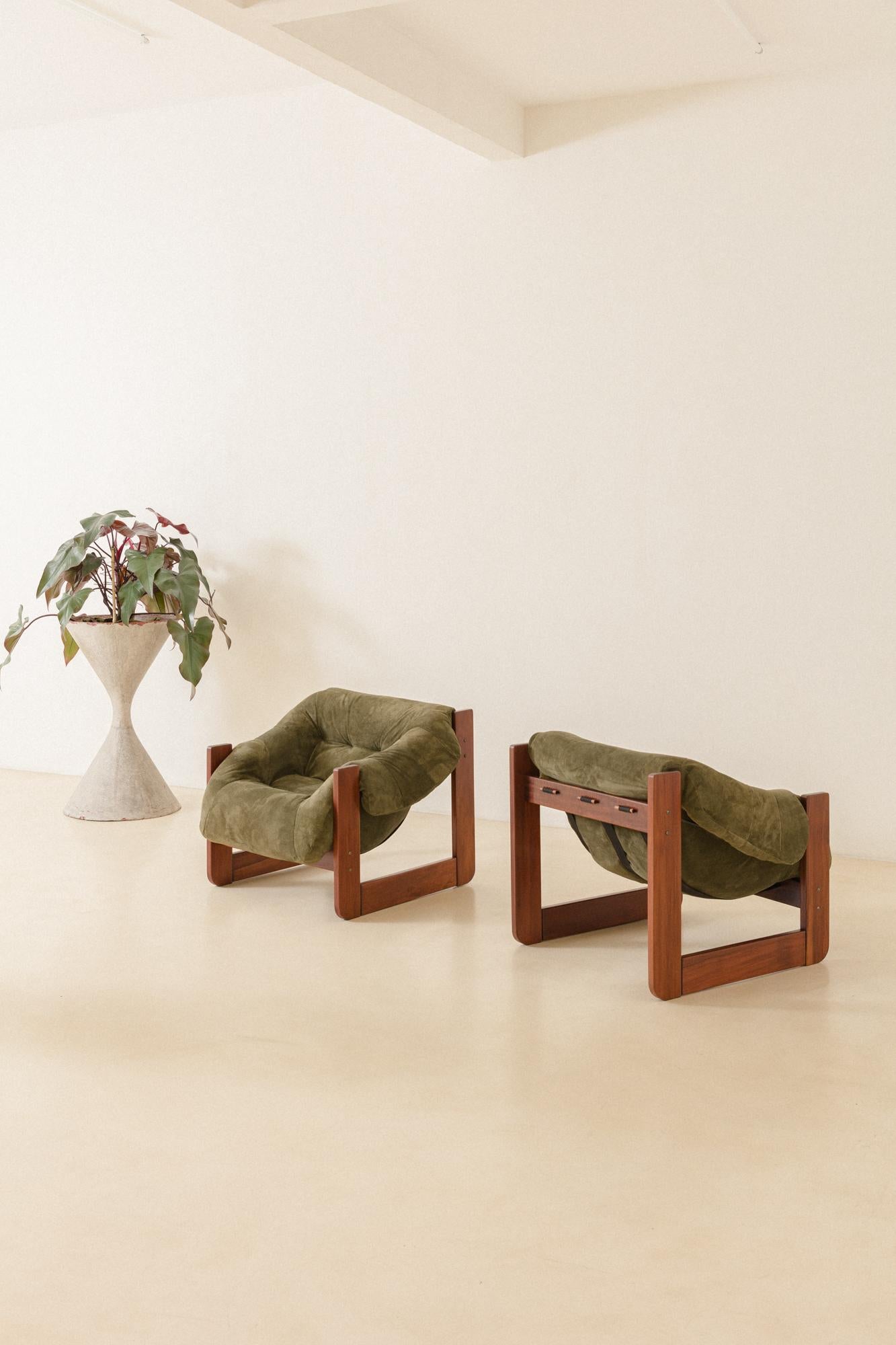 In his designs, Percival Lafer sought ergonomy and comfort. This pair of MP-97 lounge chairs by Percival Lafer comprises a solid wood structure with a single piece of a loose foam seat. Its unique design and construction make this an authentic