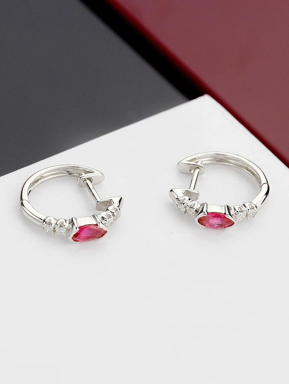 Combination of ruby and micro pave diamond huggies, all with a high polish finish. Available in 18K White Gold.

Earring Information
Diamond Type : Natural Diamond
Metal : 18K
Metal Color : White  Gold
Diamond Carat Weight : 0.10ttcw
Rubies Carat