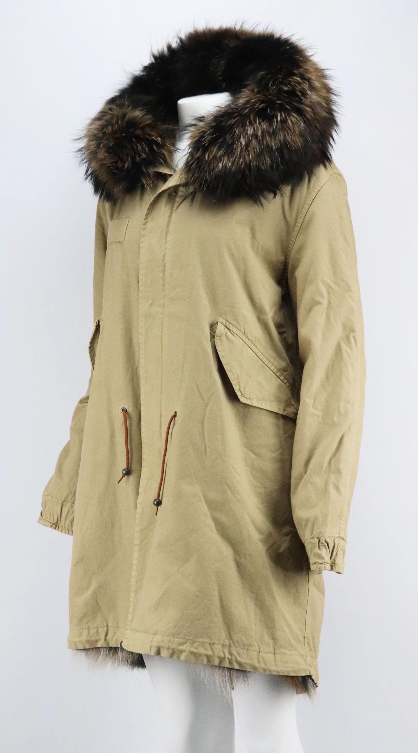 Inspired by vintage military styles, MR & MRS ITALY's parka is cut from durable beige cotton-canvas to keep you cozy as the temperatures drops, it's fully lined in soft brown coyote-fur and has an oversized fuzzy hood in raccoon-fur for added