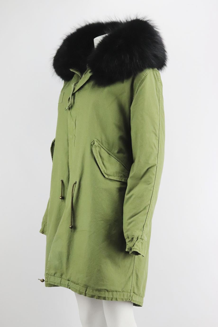 Mr & Mrs Italy rabbit and raccoon fur lined cotton canvas parka coat. Green and black. Long sleeve, crewneck. Zip fastening at front. 100% Cotton; fabric2; 100% leather; lining; 100% rabbit fur; sleeve lining; 65% cotton, 20% polyester, 15% viscose;