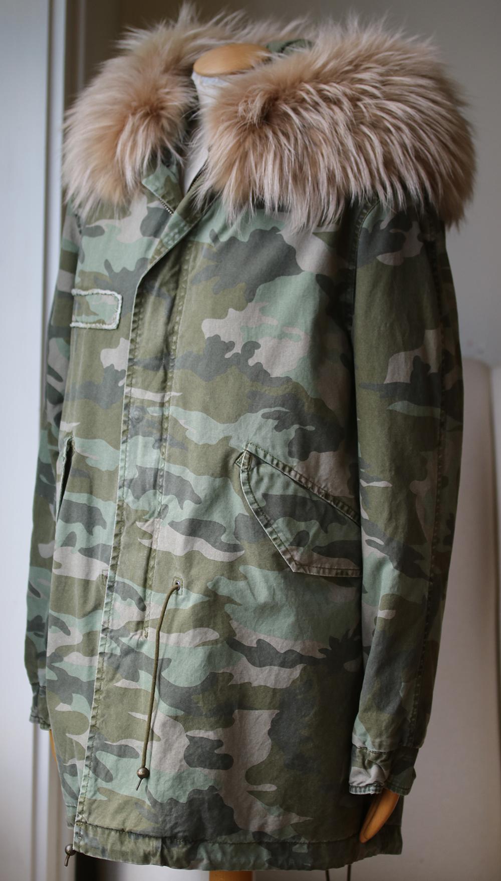 This camo-print Mr & Mrs Italy coat has a full raccoon fur collar, giving the military-inspired style a unique, luxurious twist. Snaps conceal the zip closure, and toggled cords cinch the waist and hem. 2 pockets. Long sleeves. Fiber fill. Fur: Dyed