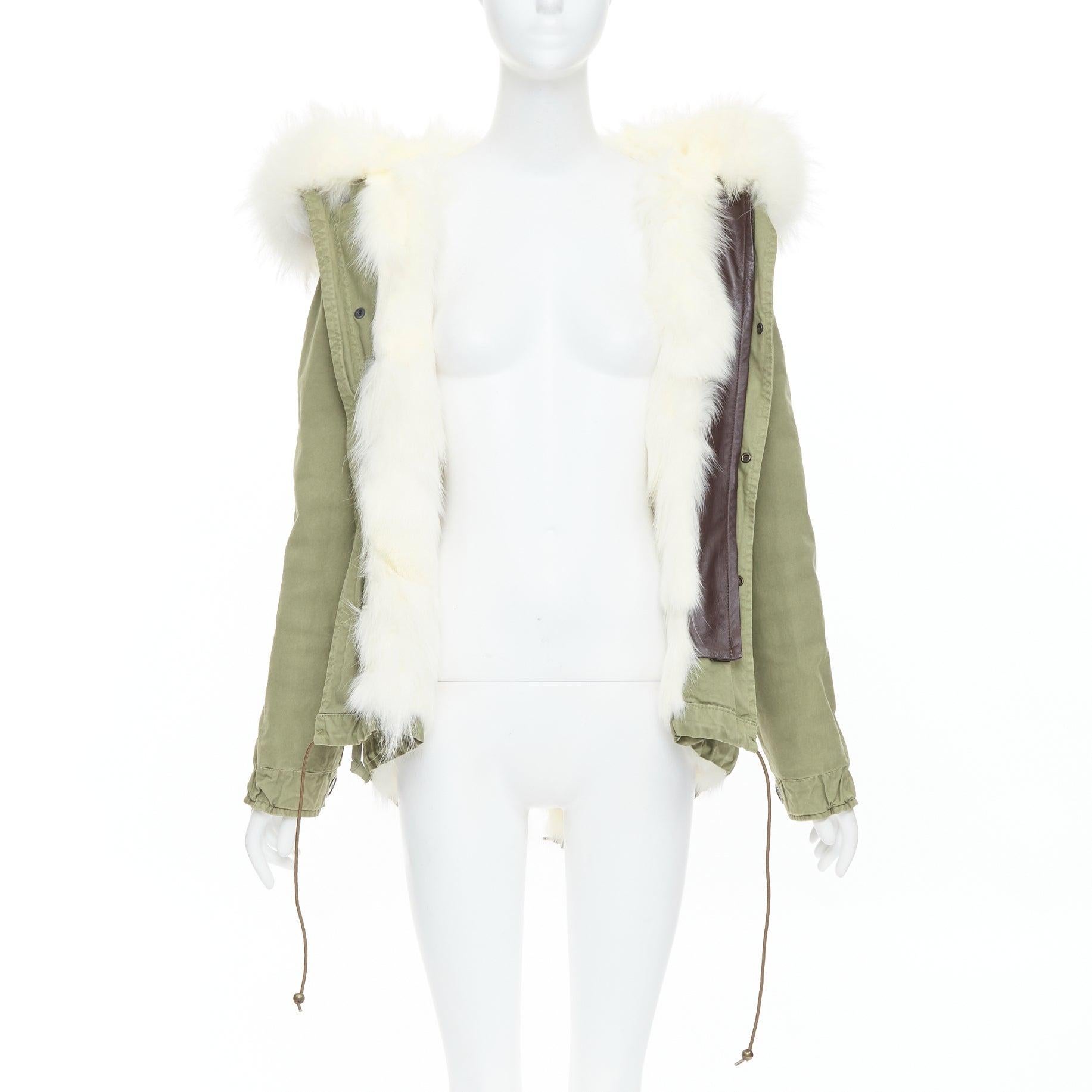 MR AND MRS ITALY  white fur lined hooded military green parka coat XXS
Reference: GEGG/A00167
Brand: Mr and Mrs Italy
Material: Cotton, Leather, Fur
Color: Green, Cream
Pattern: Solid
Closure: Zip
Lining: Cream Fur
Extra Details: The Mr & Mrs Italy