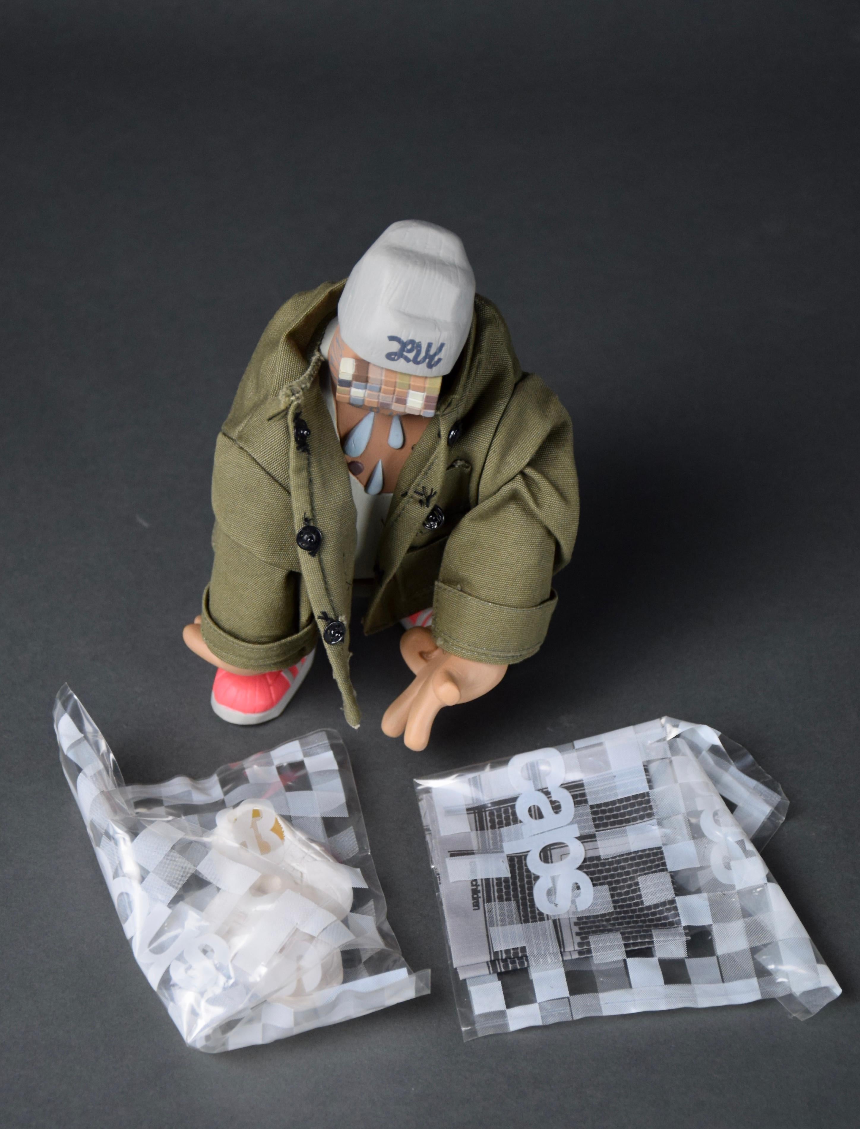 Mr. B limited edition of 200 pcs 2001 Art Toy from the Crazy Children series by Michael Lau. Produced by Crazy Smiles. This rare piece comes with it's original box, Jacket, Cap, Adidas Shoes and Scarf all in great condition. Mr. B has never been