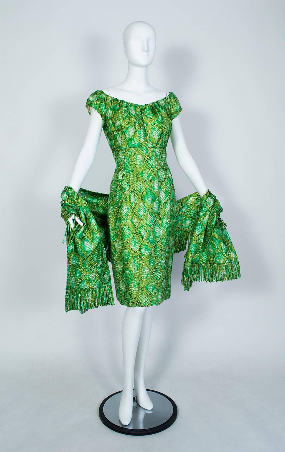 In a nod to Biblical symbolism, Mr Blackwell presents an apple green snake print wiggle dress whose curves could tempt the most pious bystander. The best part (besides the incredible color) is the oversized matching fringe wrap, which is large