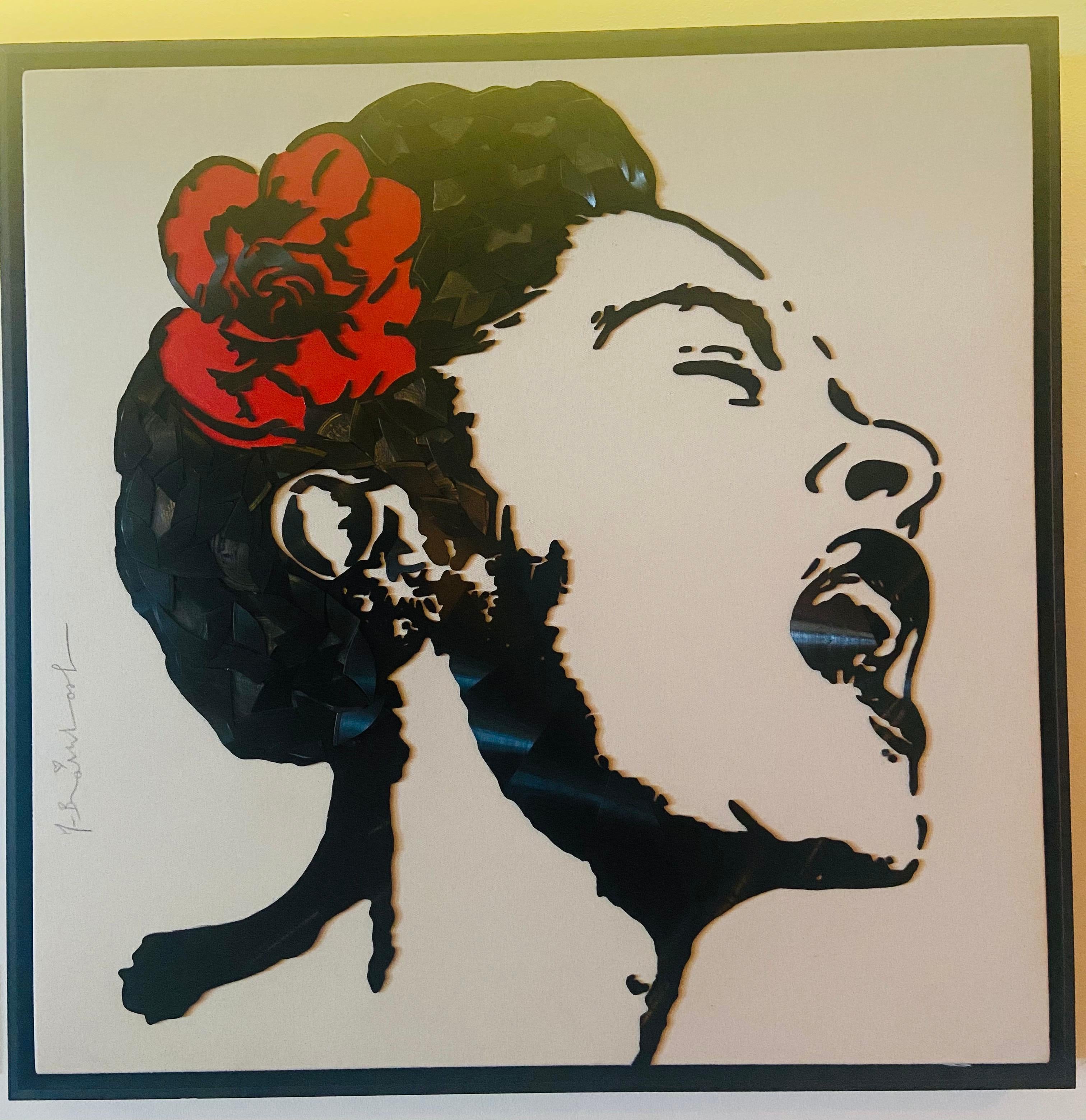 In this particular work composed by pieces of vinyl on canvas the artist represents Billie Holiday, the famous American singer of jazz and blues. The protagonist is surrounded by a white background, unusual for the artist, while she is singing. The