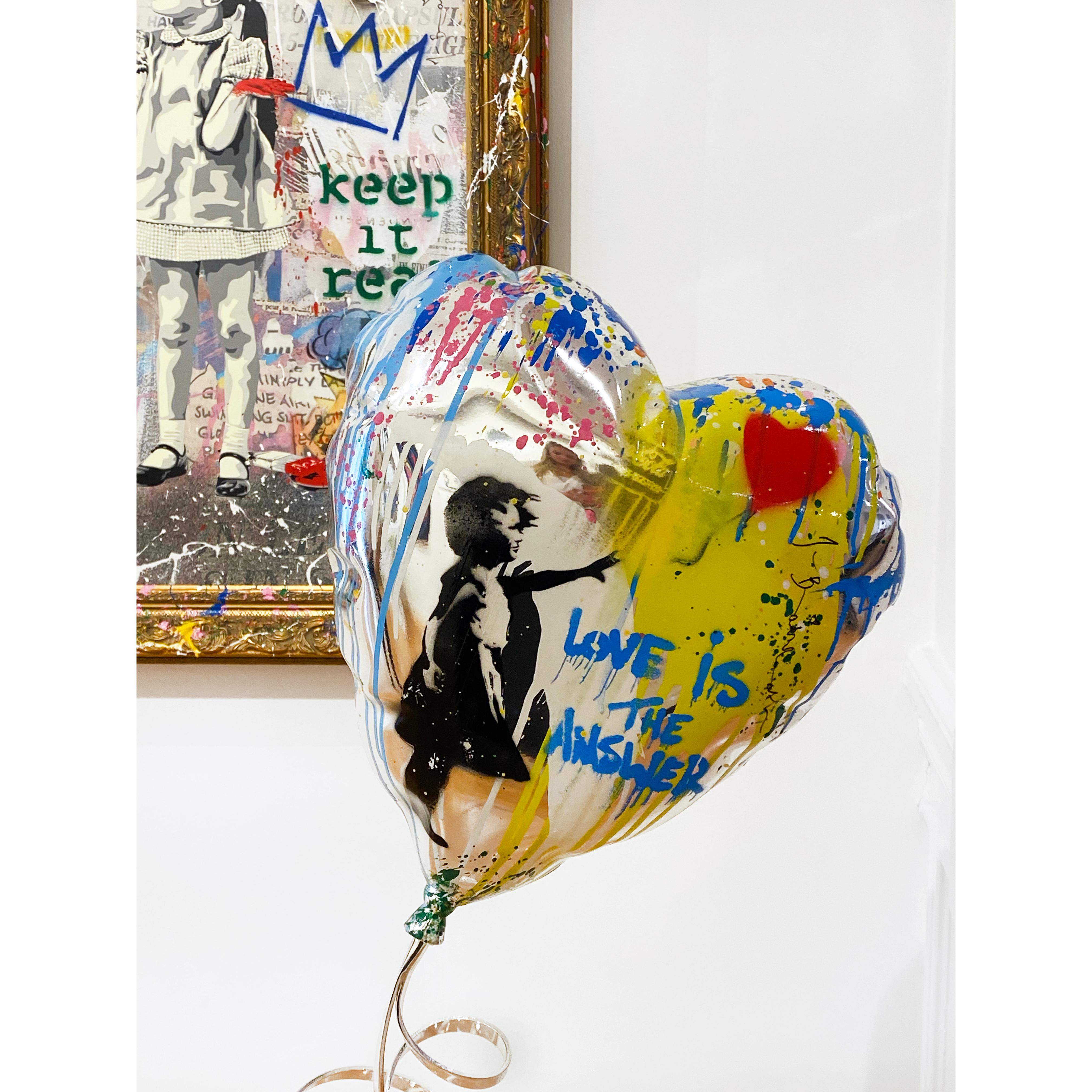 Artist:  Brainwash, Mr.
Title:  Flying Balloon Heart
Date:  2023
Medium:  Stencil and Mixed Media on Fiberglass and acrylic base
Unframed Dimensions:  32