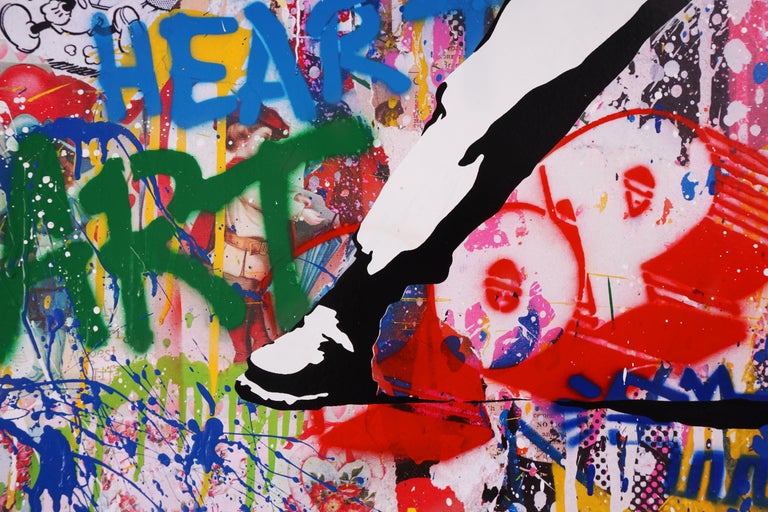 The graffiti street-art meets fine-art 'Banksy Thrower II' is a brilliant contemporary pop art masterpiece made with acrylic paint, spray painted stencil, and mixed media on paper, created in 2021 by street-artist, Mr. Brainwash. The vivid stenciled