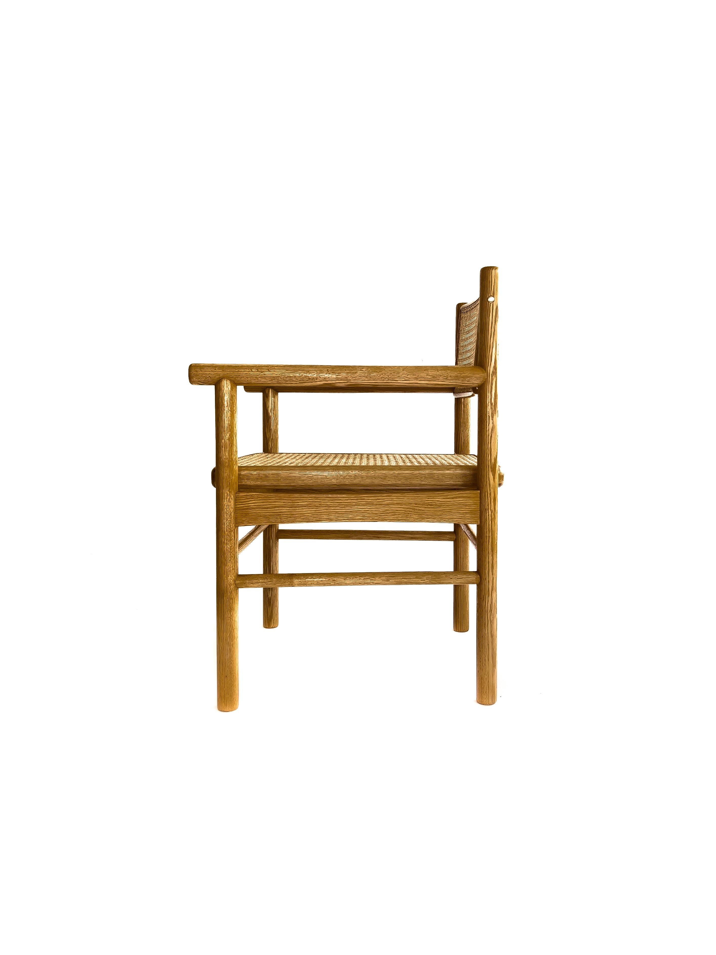 Hand-Crafted Mr. Cane,  hand canned wicker dining armchair with a self adjustable swivel back For Sale
