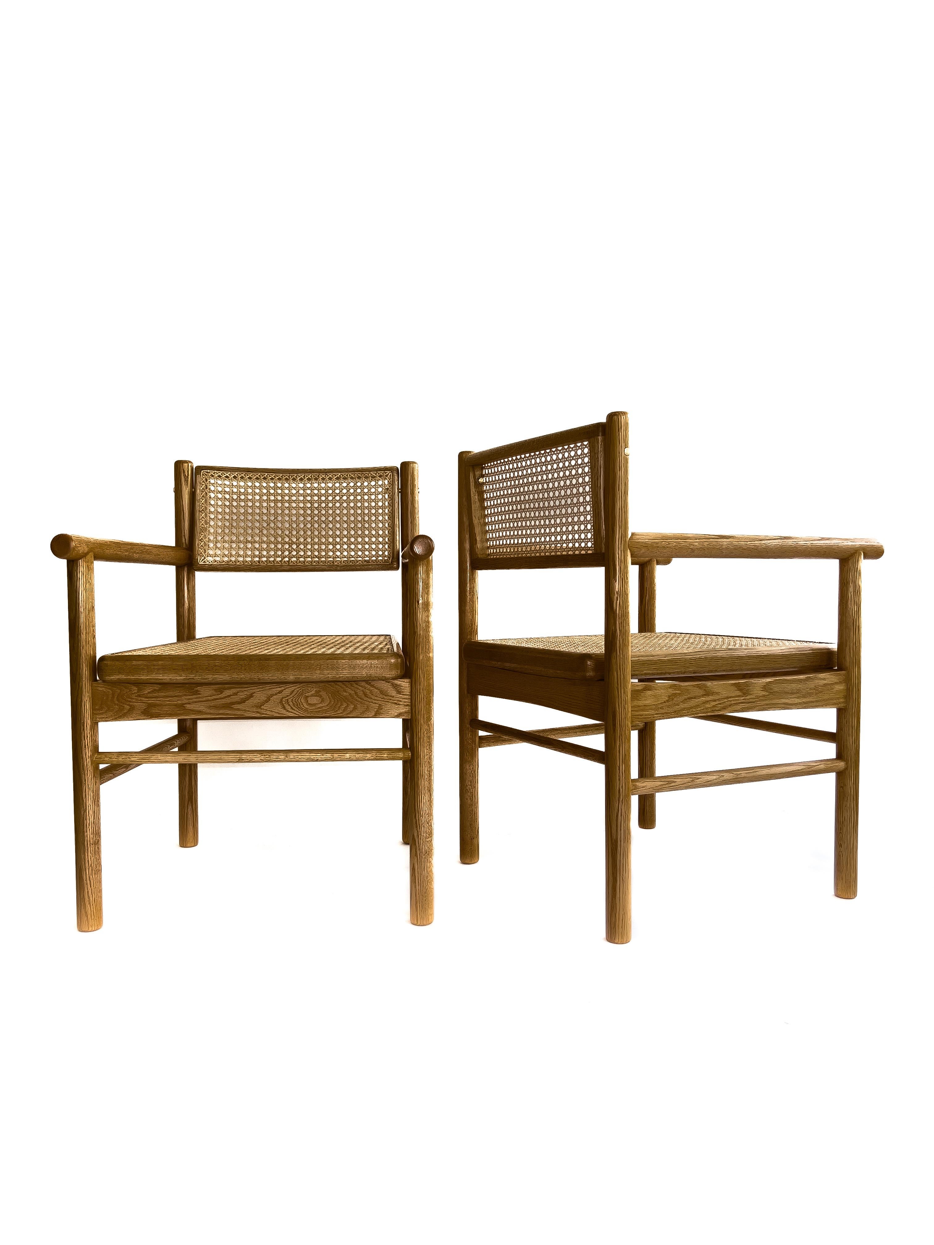 Contemporary Mr. Cane,  hand canned wicker dining armchair with a self adjustable swivel back For Sale