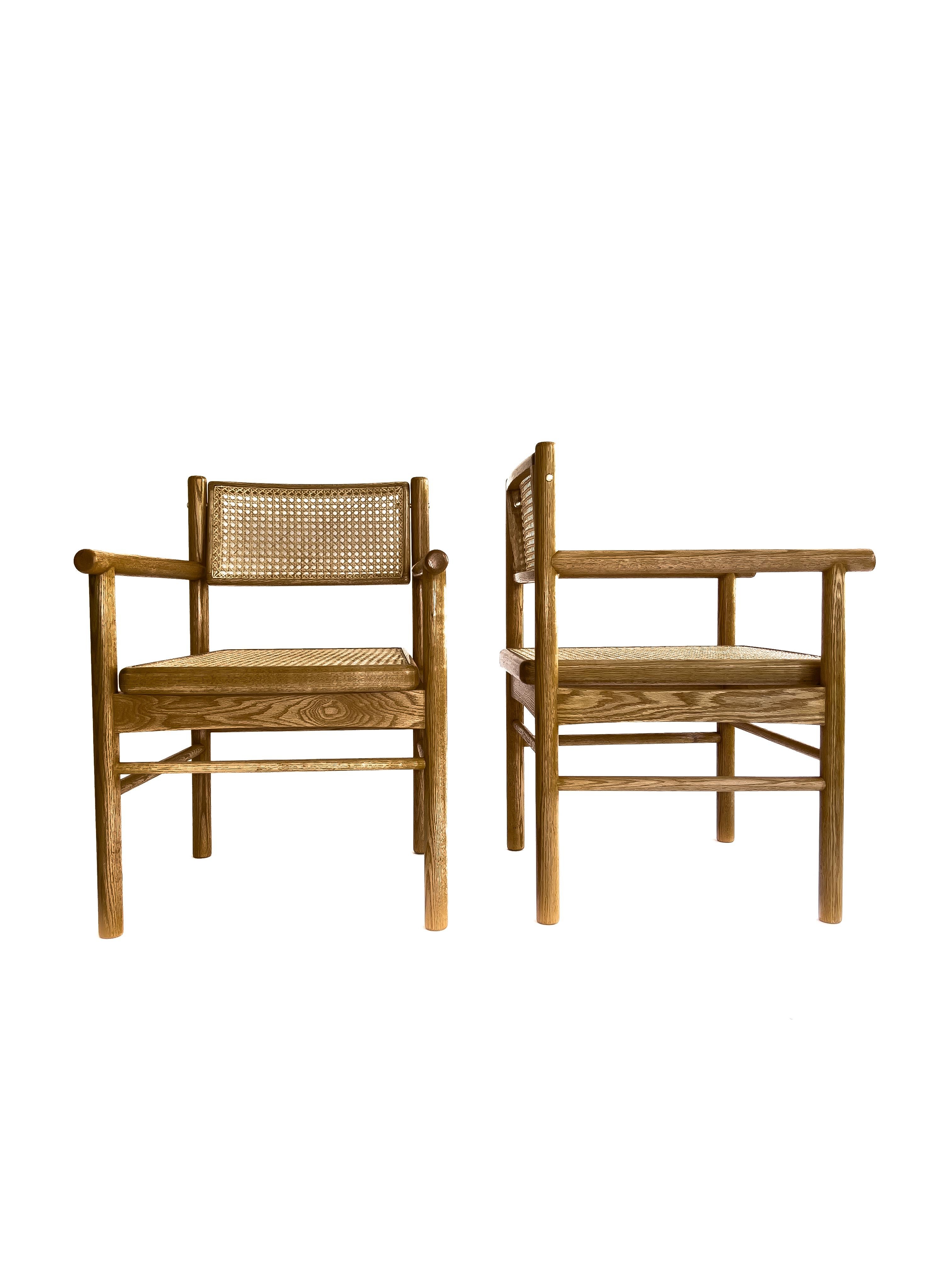 Brass Mr. Cane,  hand canned wicker dining armchair with a self adjustable swivel back For Sale