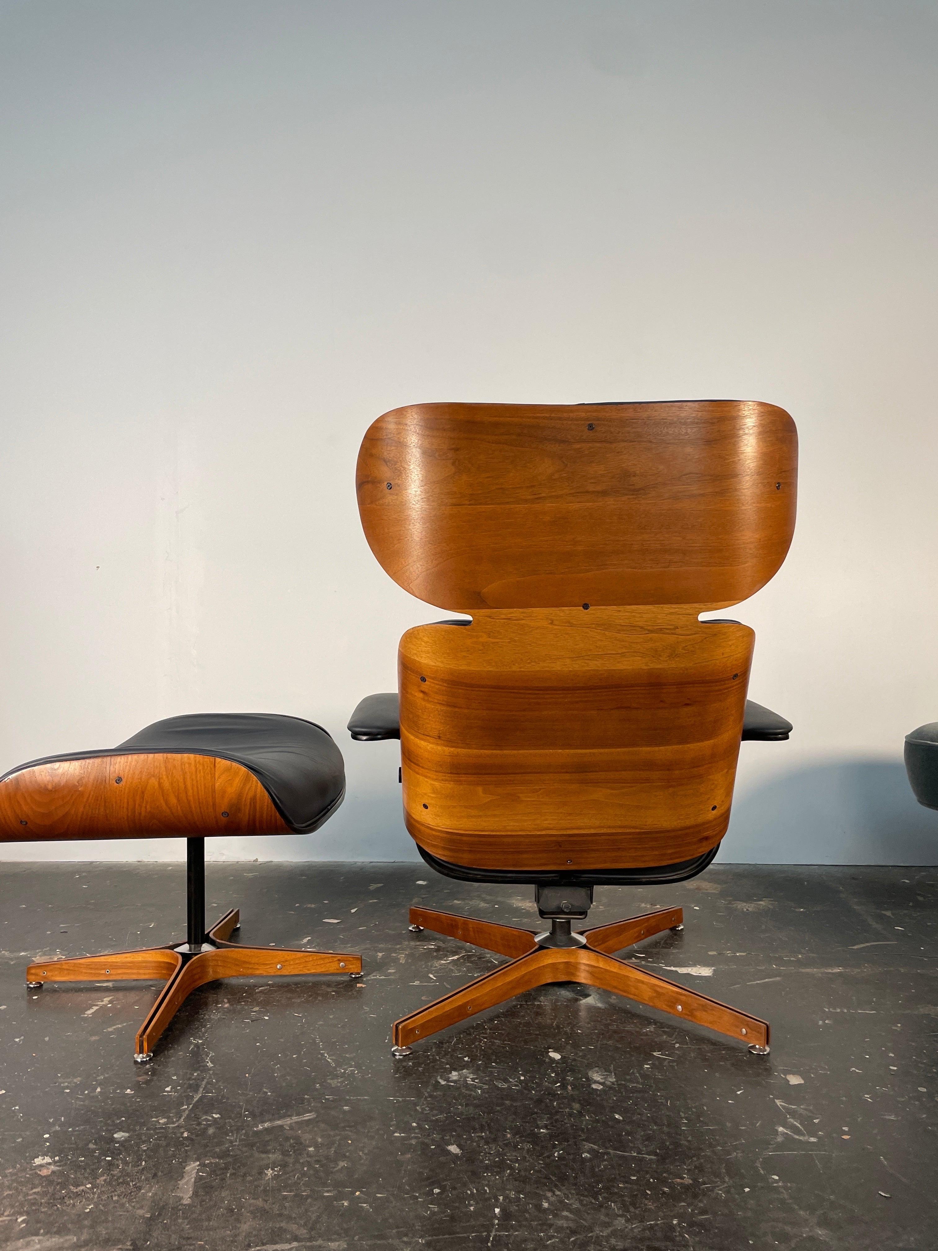 This is a rarely seen Mr. Chair recliner with built in ottoman. Newly reupholstered in new black Italian leather. This is a very rare variation of the Mr Chair it was designed to have a smaller foot print. This chair can lean way back and it is the