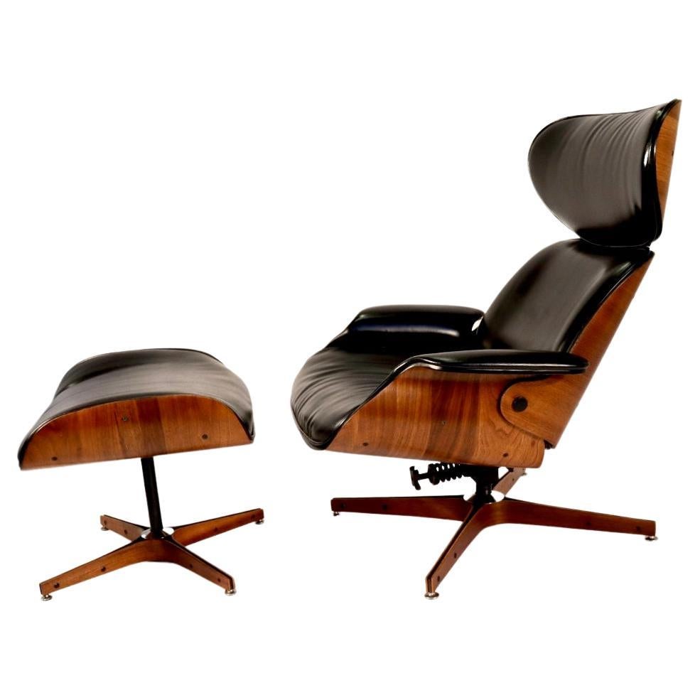 We have just restored this iconic 'Mr. Chair' lounge chair and ottoman. It was designed by George Mulhauser for Plycraft circa 1950's. The beautiful bentwood shell is executed in walnut and accentuated by its flared arms and back. It tilts back in a